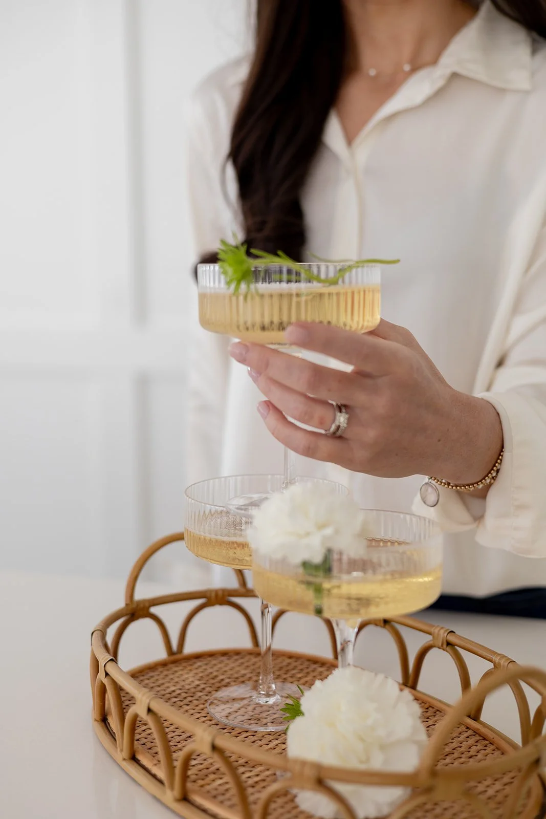 Georgia wedding planner holds cocktail in coupe glass