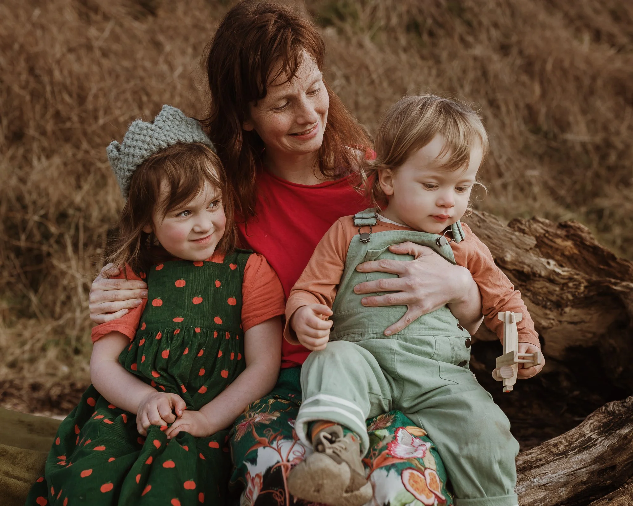 Photograph of a mother with her two children at Half Moon Bay
