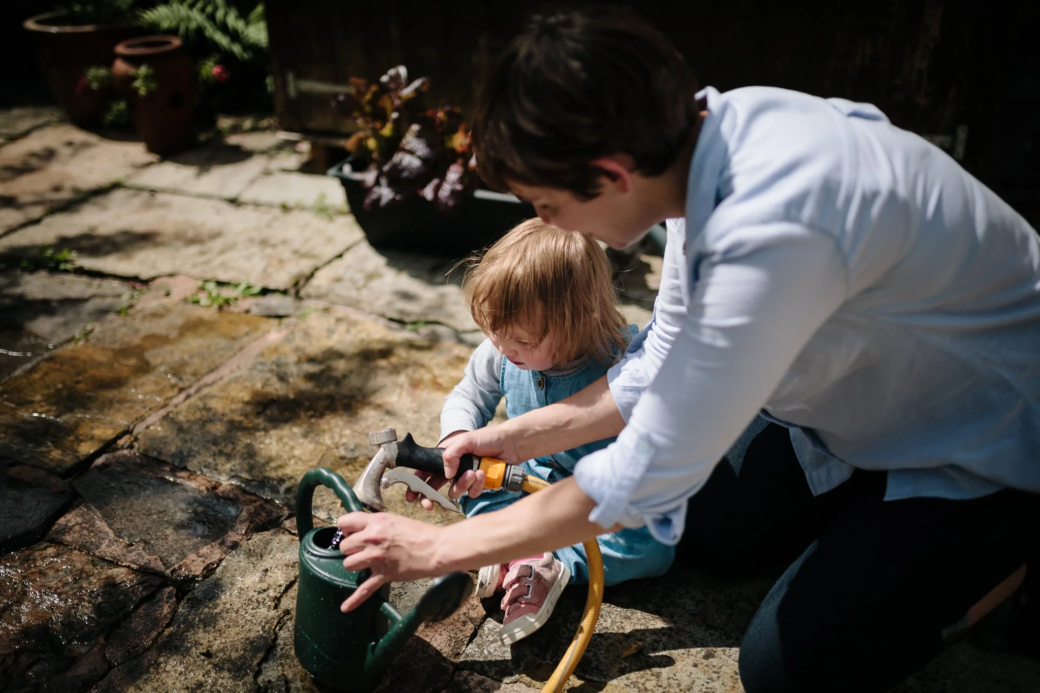 Maternity photograph of a pregnant woman in a floaty dress at the beach