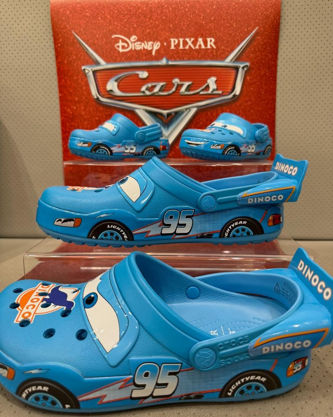 The Lightning McQueen Dinoco Crocband&trade; Clog has arrived at the Crocs store at La Palmera! While supplies last. One pair per person. 🦕