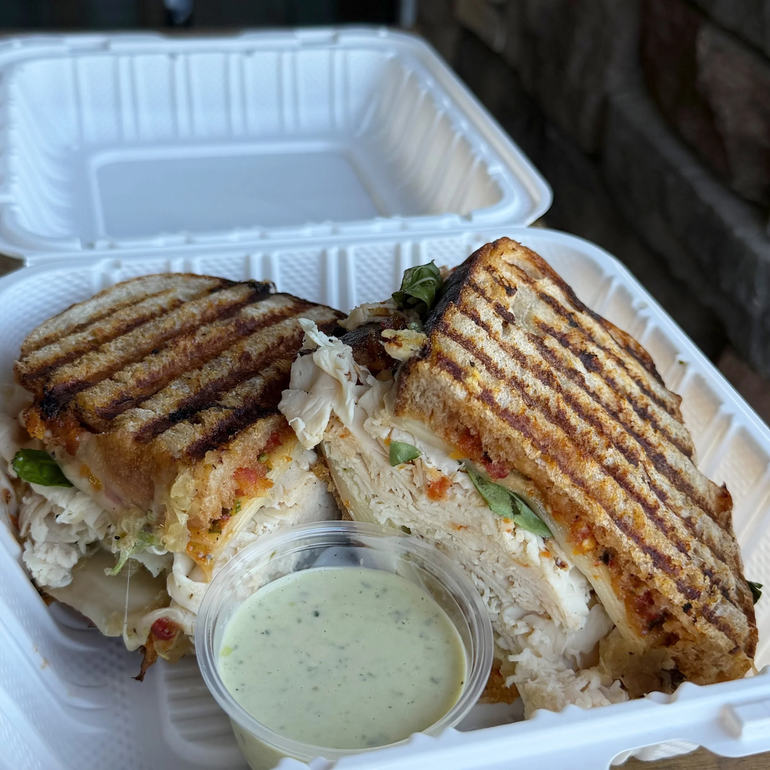 This weeks special: The Parmi 🥪

Available 4/27 - 5/1 

Roasted chicken 
Roasted Tomato Aioli
White cheddar 
Provolone 
Parmesan 
Fresh basil
Caramelized onion 
Comes with a side of black truffle green pepper sauce