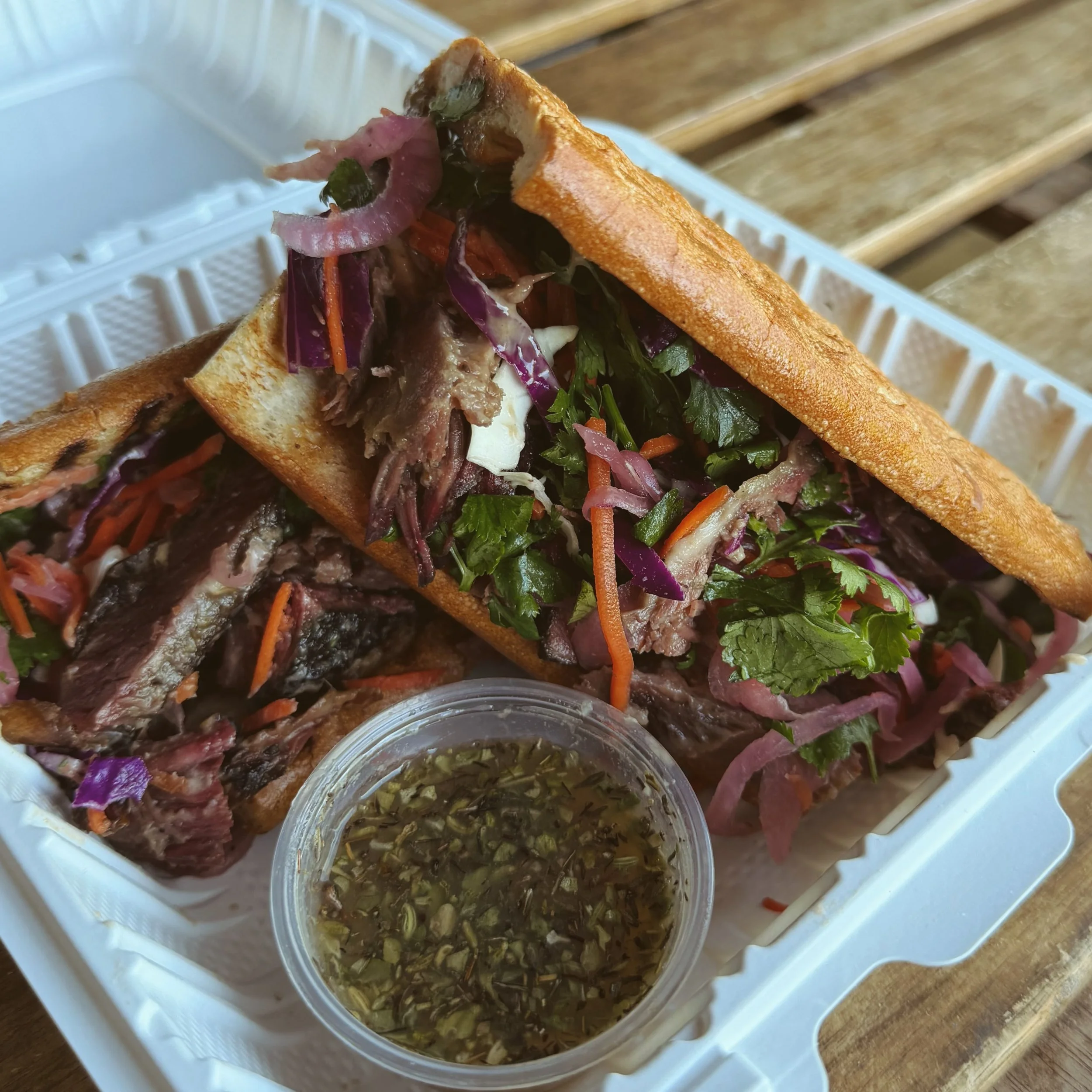The Galbi

In collaboration with @tallow_and_smoke_bbq 

8 hour smoked Brandt dino ribs, Korean slaw, root beer koji galbi glaze, and black garlic&ndash;miso umami aioli on a lightly toasted French baguette.
Served with an Asian pear and ginger dippi