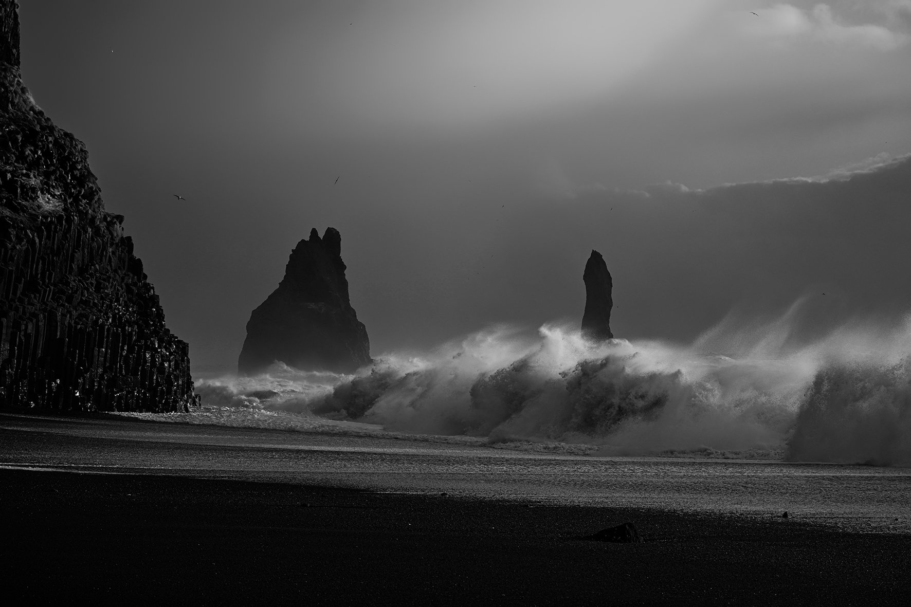 Big waves crushing on black beach at Reynisdrangar, Iceland, with iconic rock formations engulfed in rough and powerful water | Vík í Mýrdalur on the South Coast of Iceland.jpg