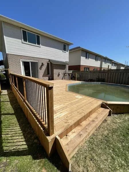 above-ground-pool-wraparound-cedar-deck-wood-railing