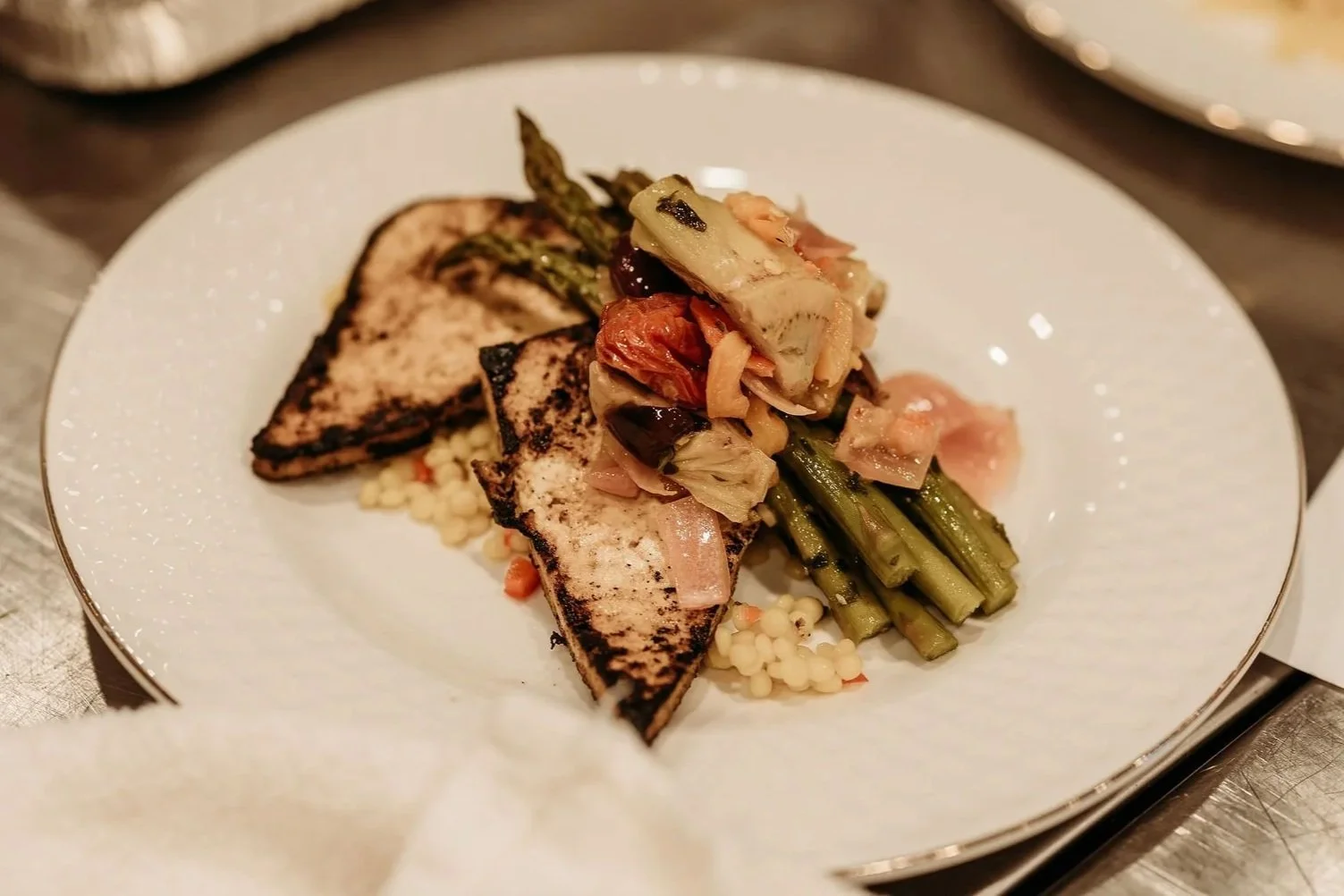 photo of dinner plate with fish and vegetables