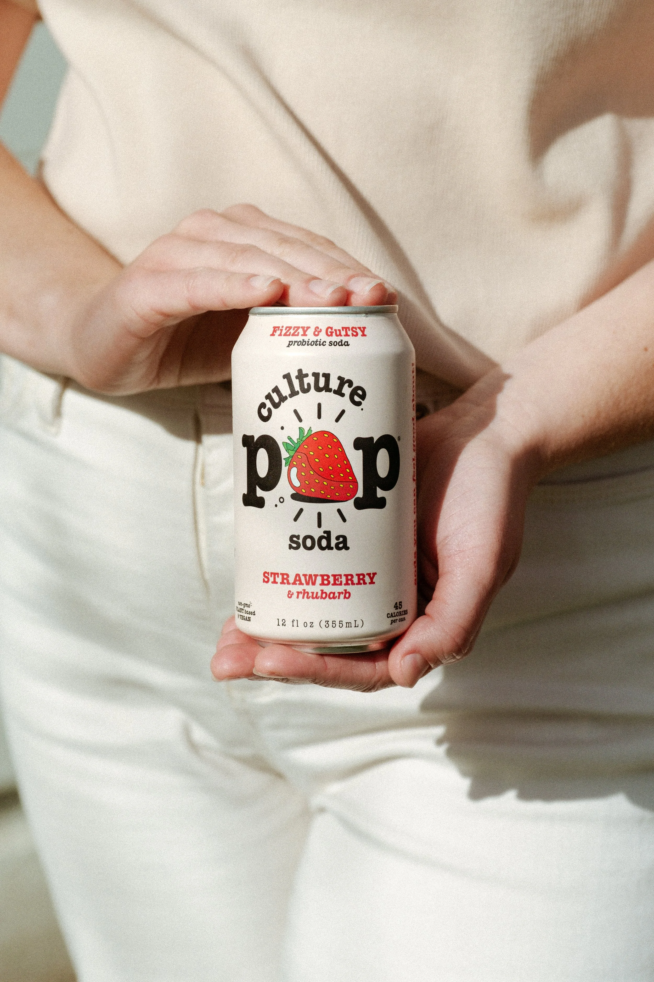 Female holding Culture Pop Soda