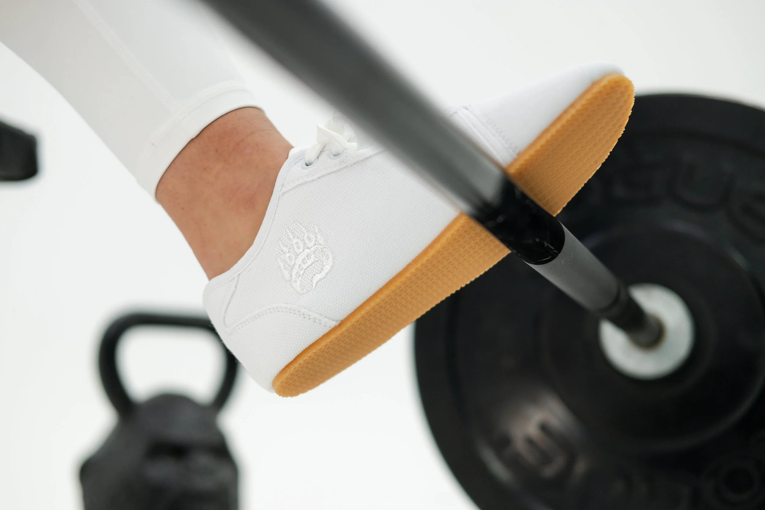 Bearfoot shoes on barbell