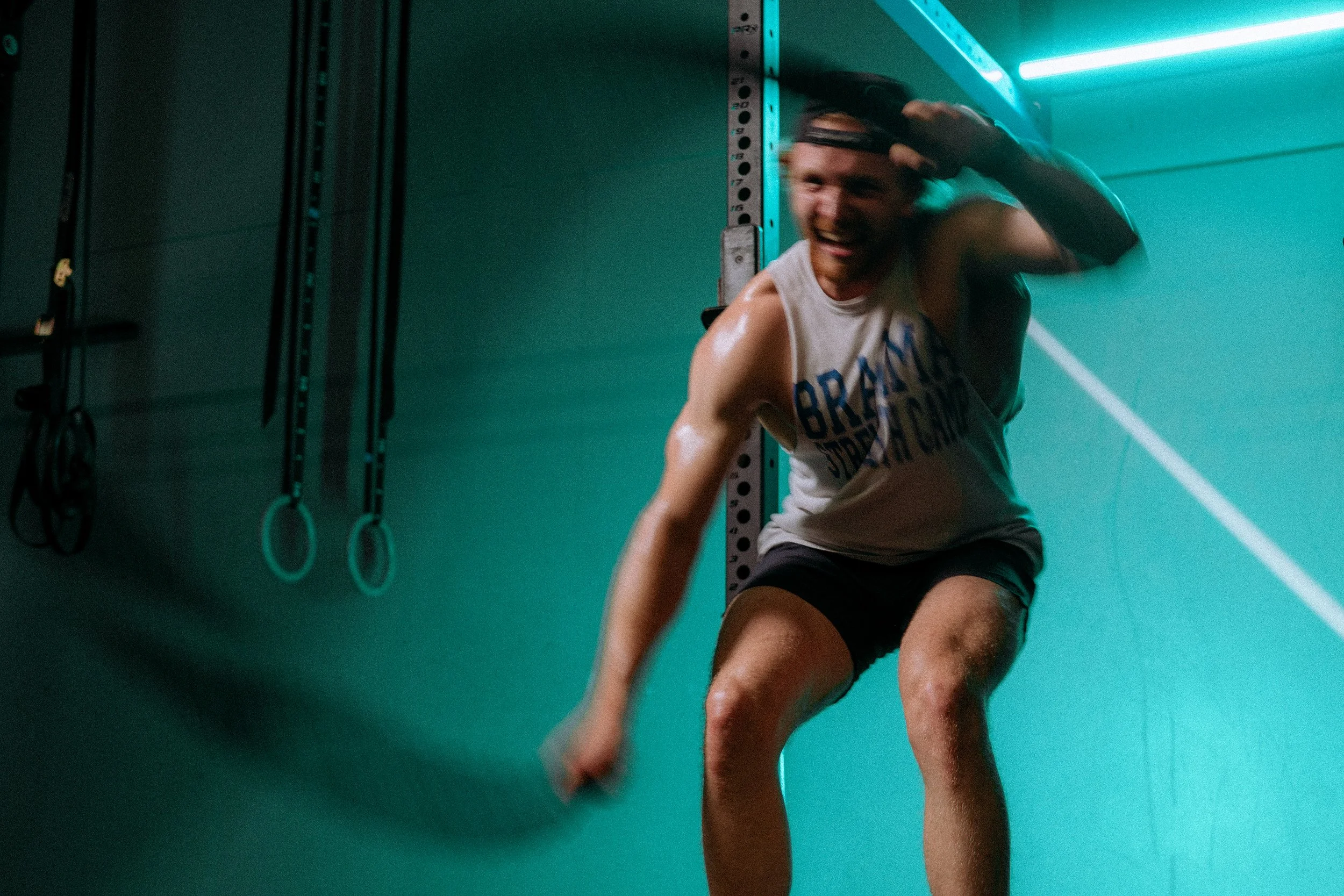 Man doing rope exercises aggressively.