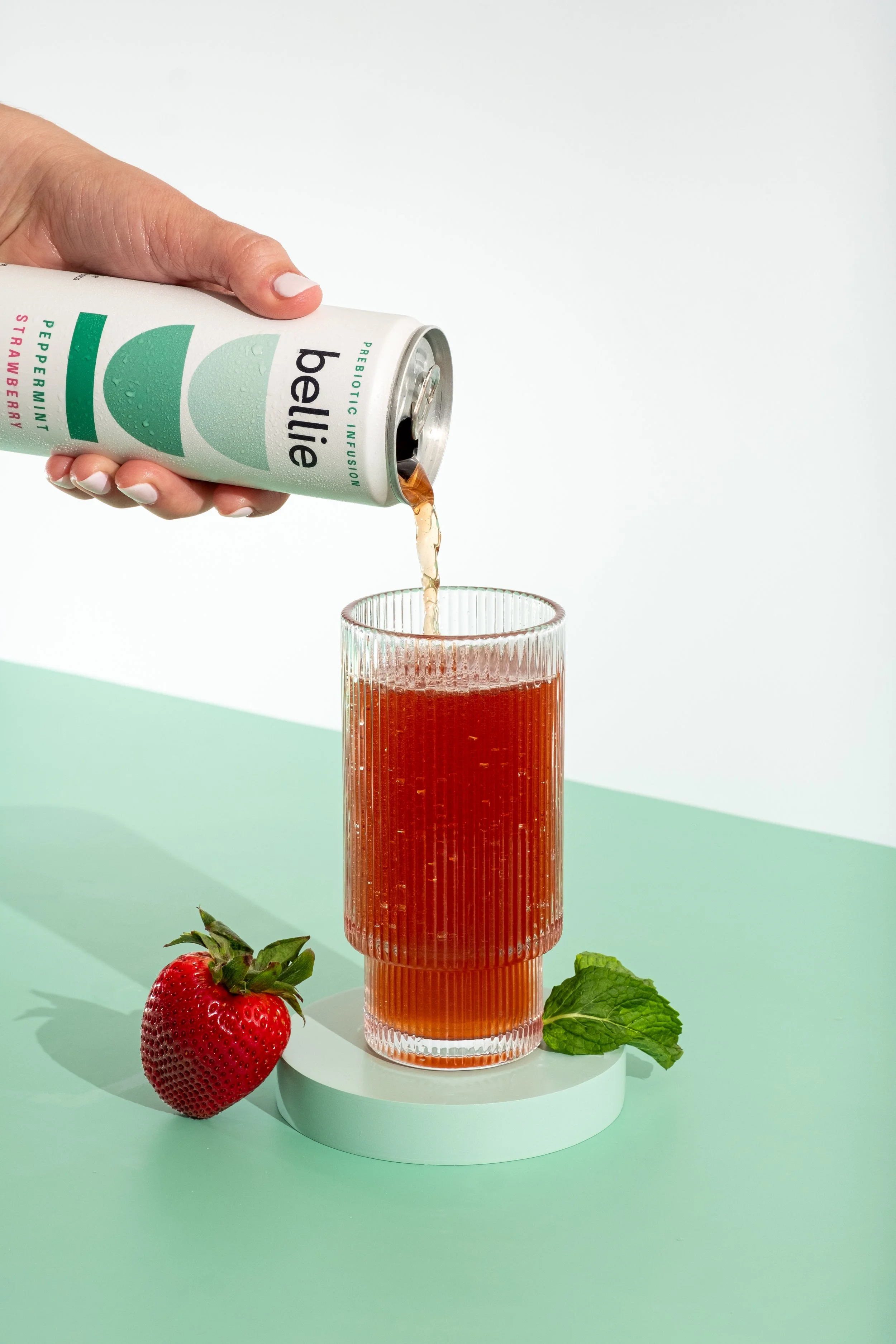Bellie beverage pouring into vintage glass