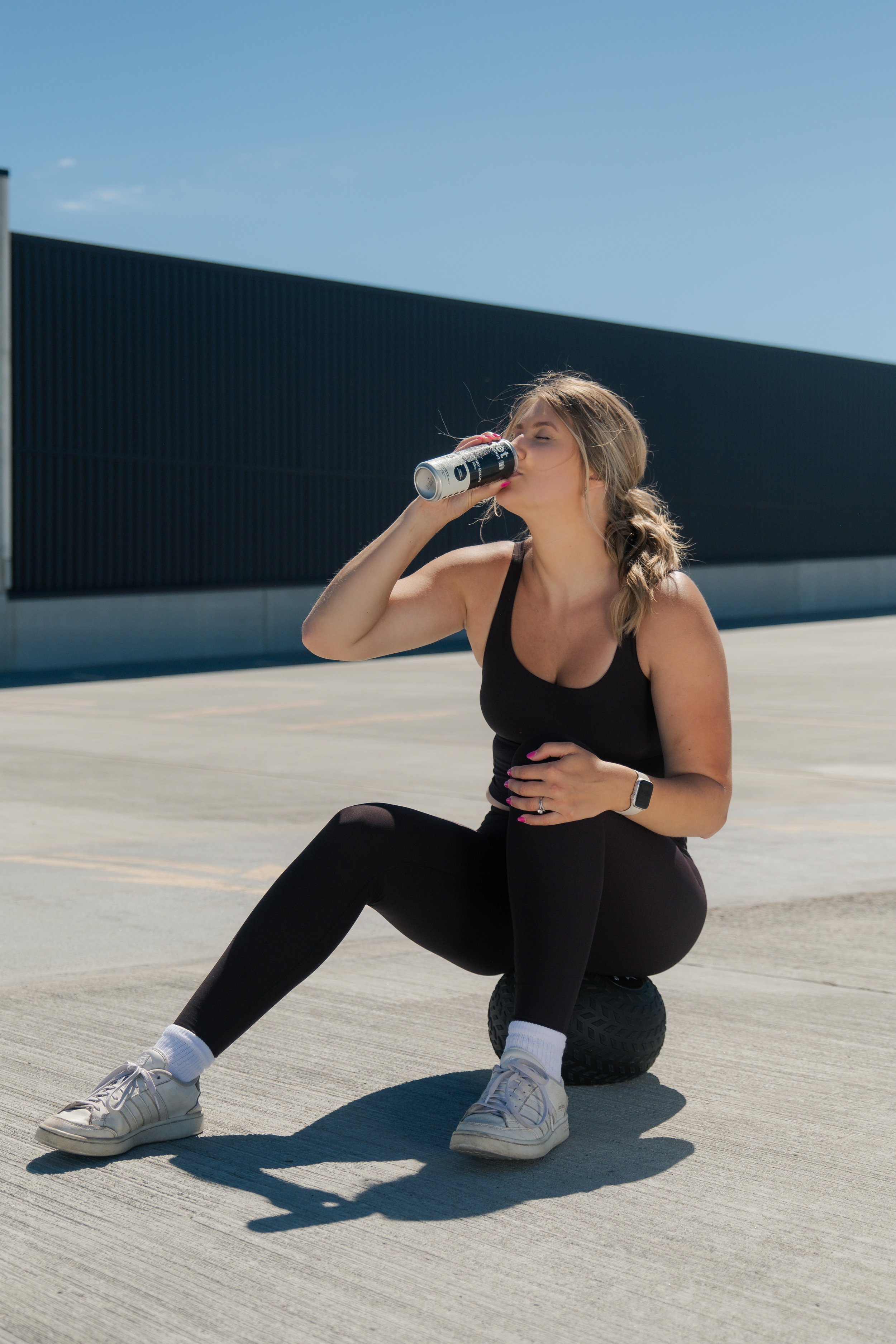 Woman drinking a hydration drink