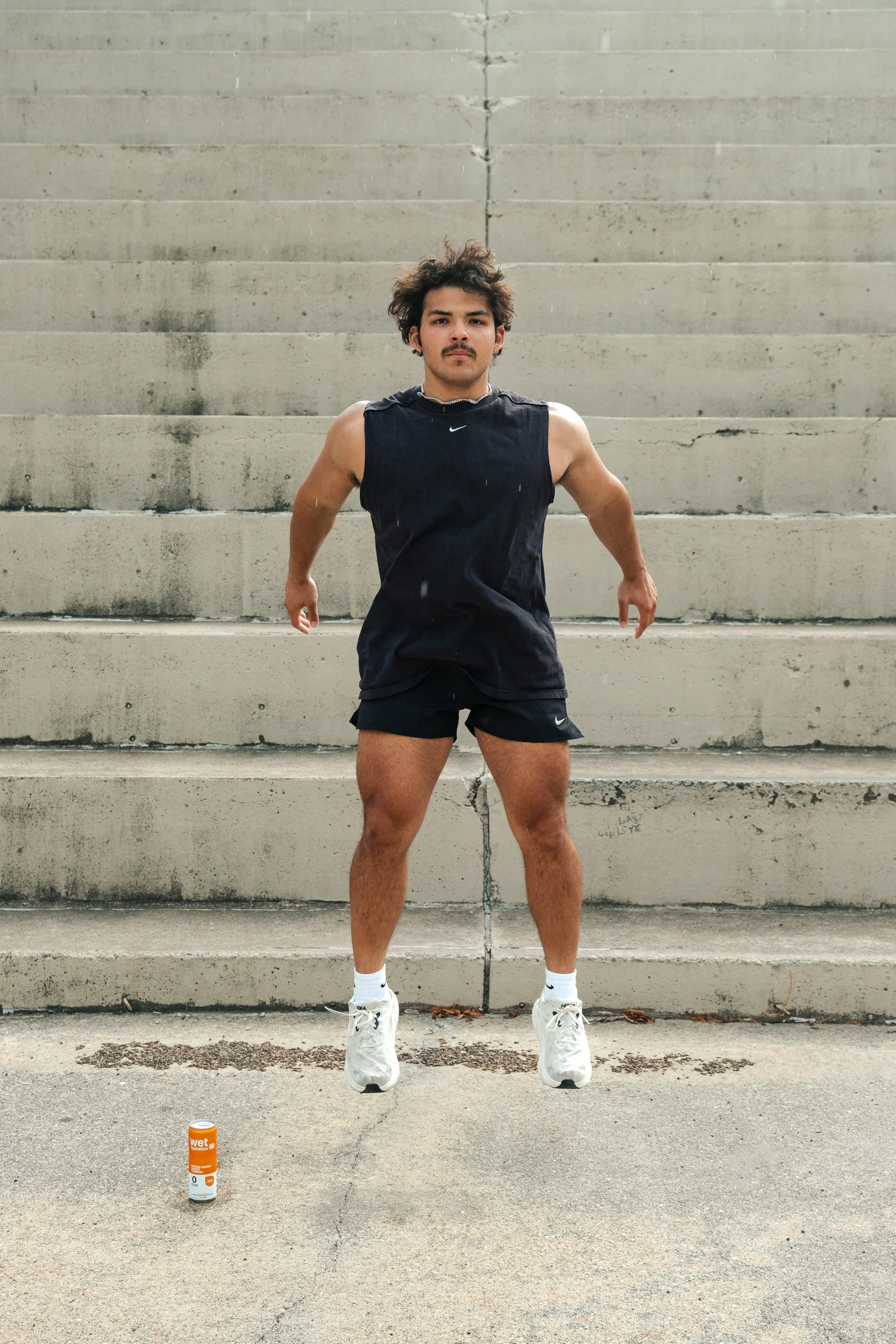 Man doing jump squats