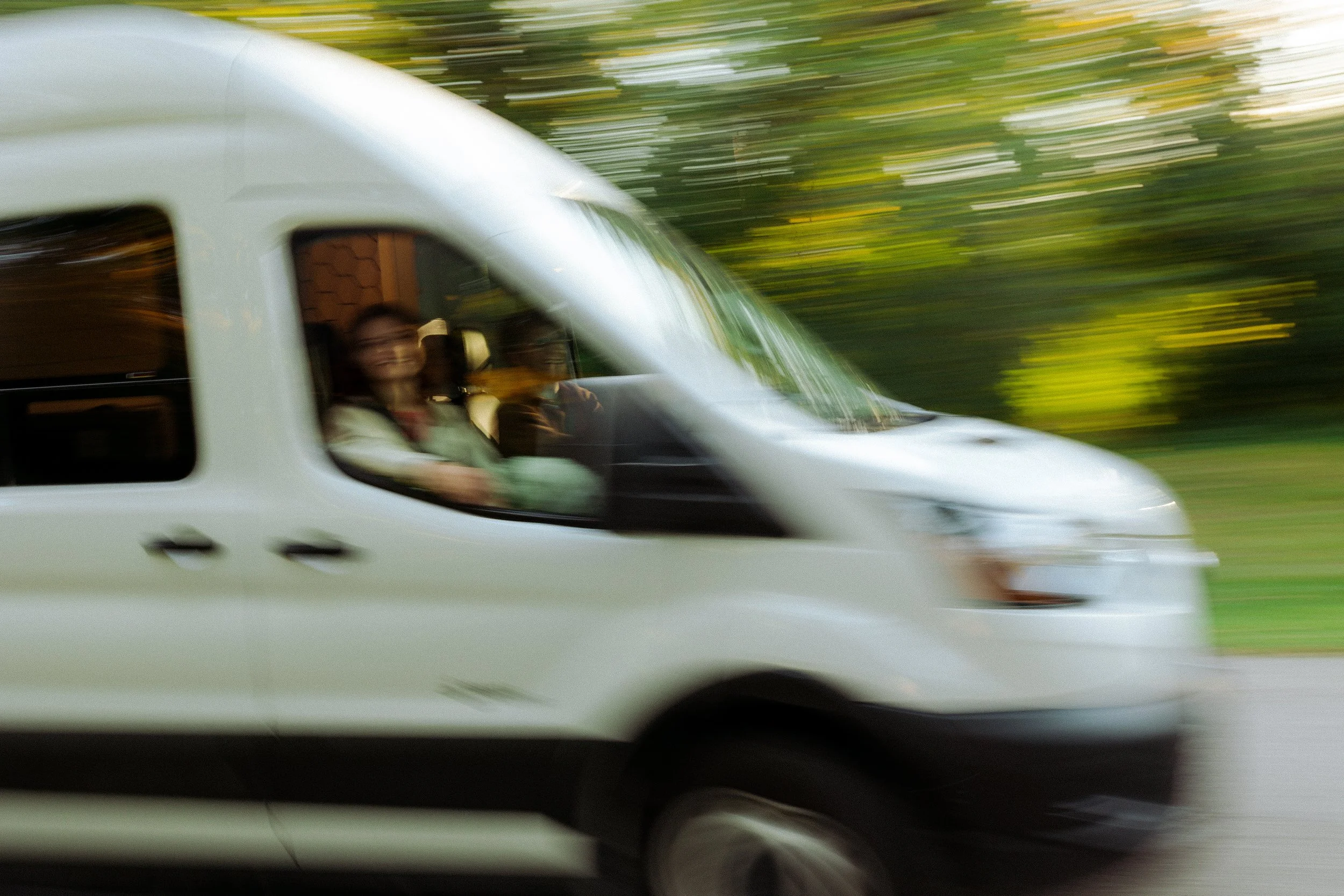 Custom van driving by fast.