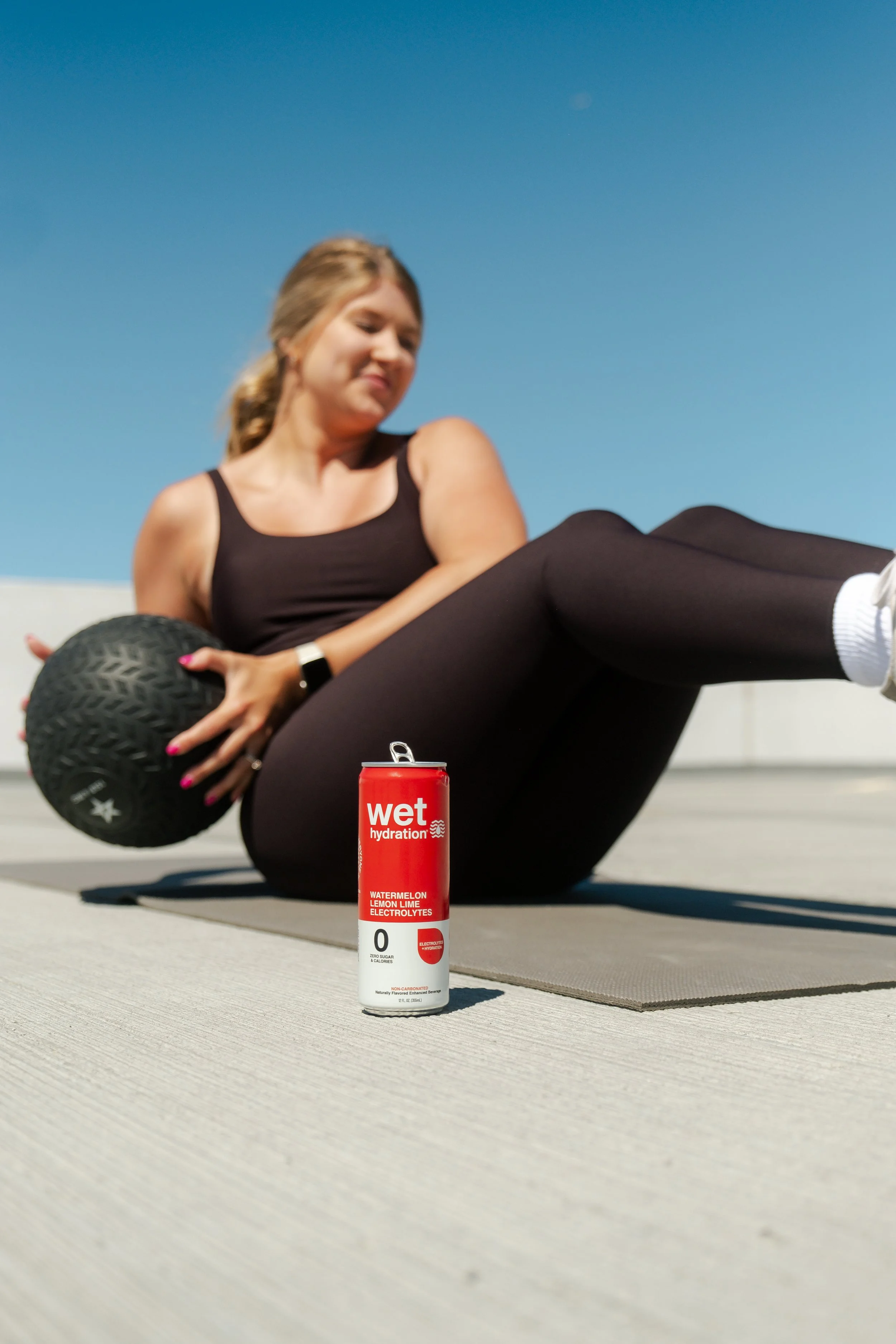 Woman doing medicine ball crunches