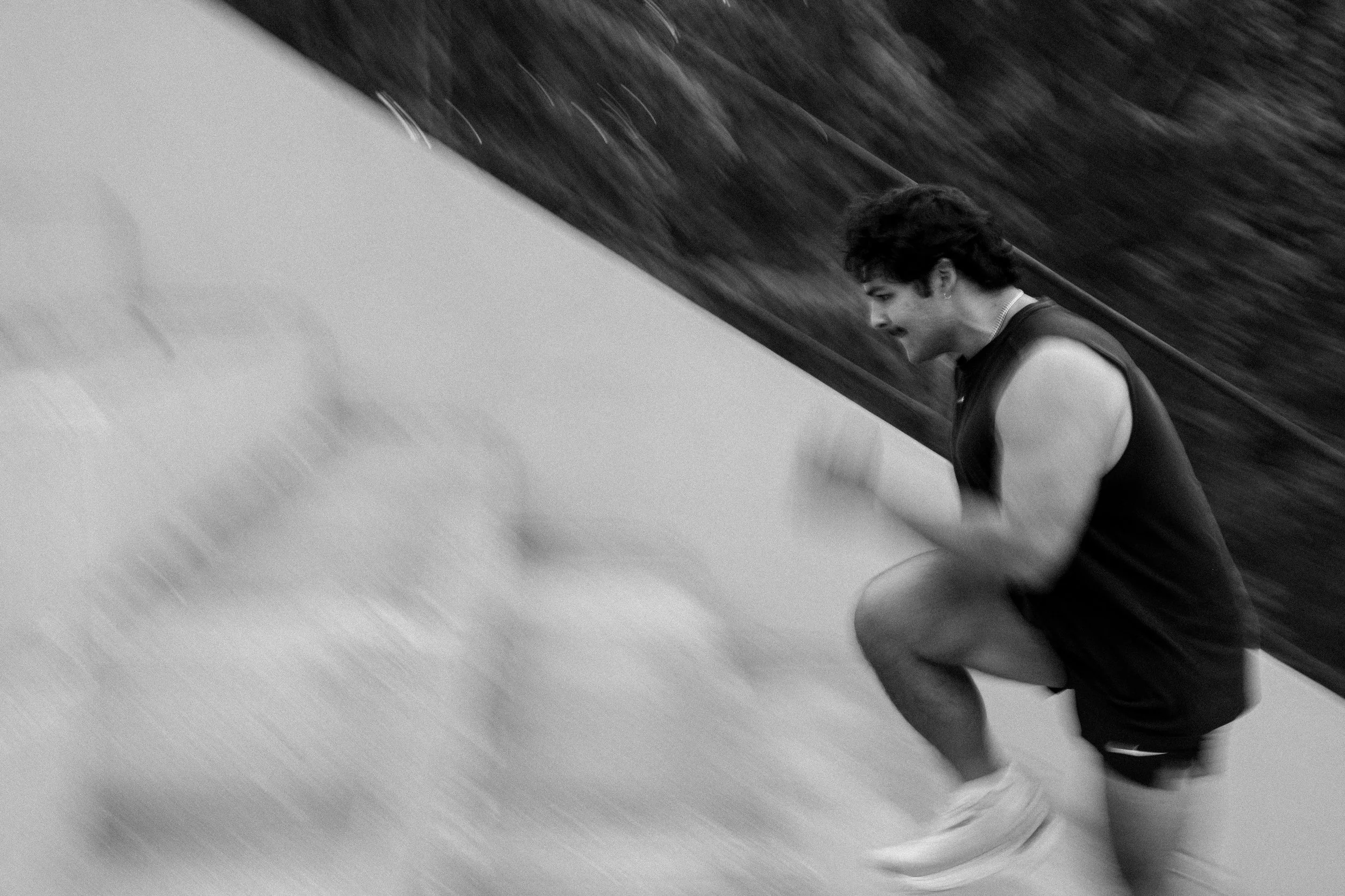 Man running up bleachers quickly