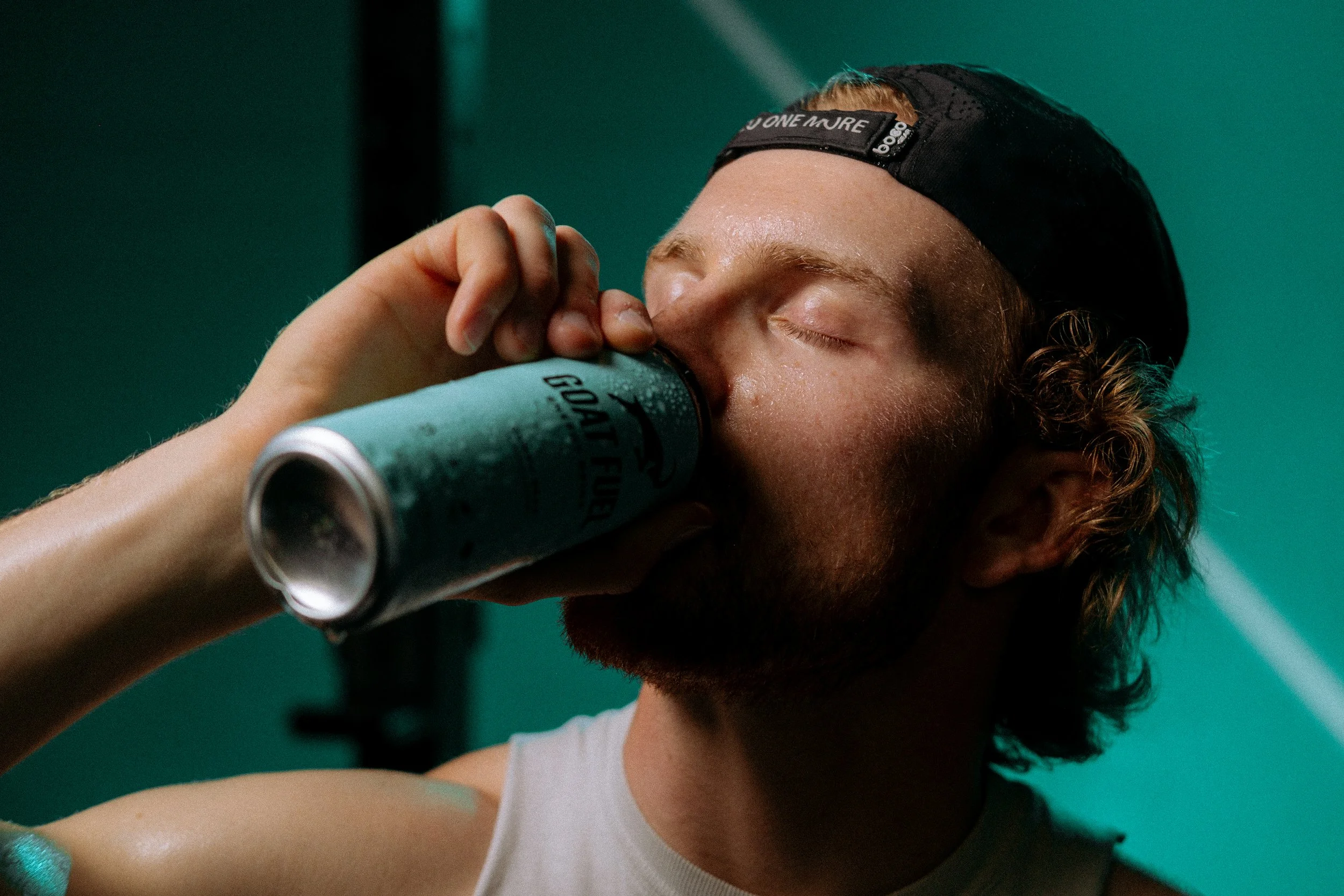 Man drinking Gummy Bear flavored Goat Fuel.