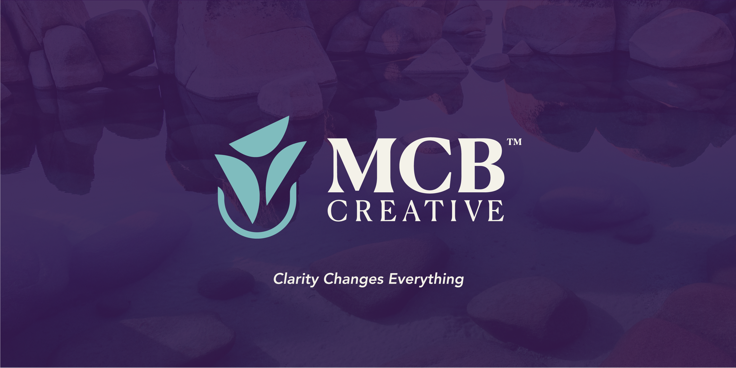MCBCreative logo displayed over a serene cairn landscape, representing clarity, growth, and strategic brand guidance.