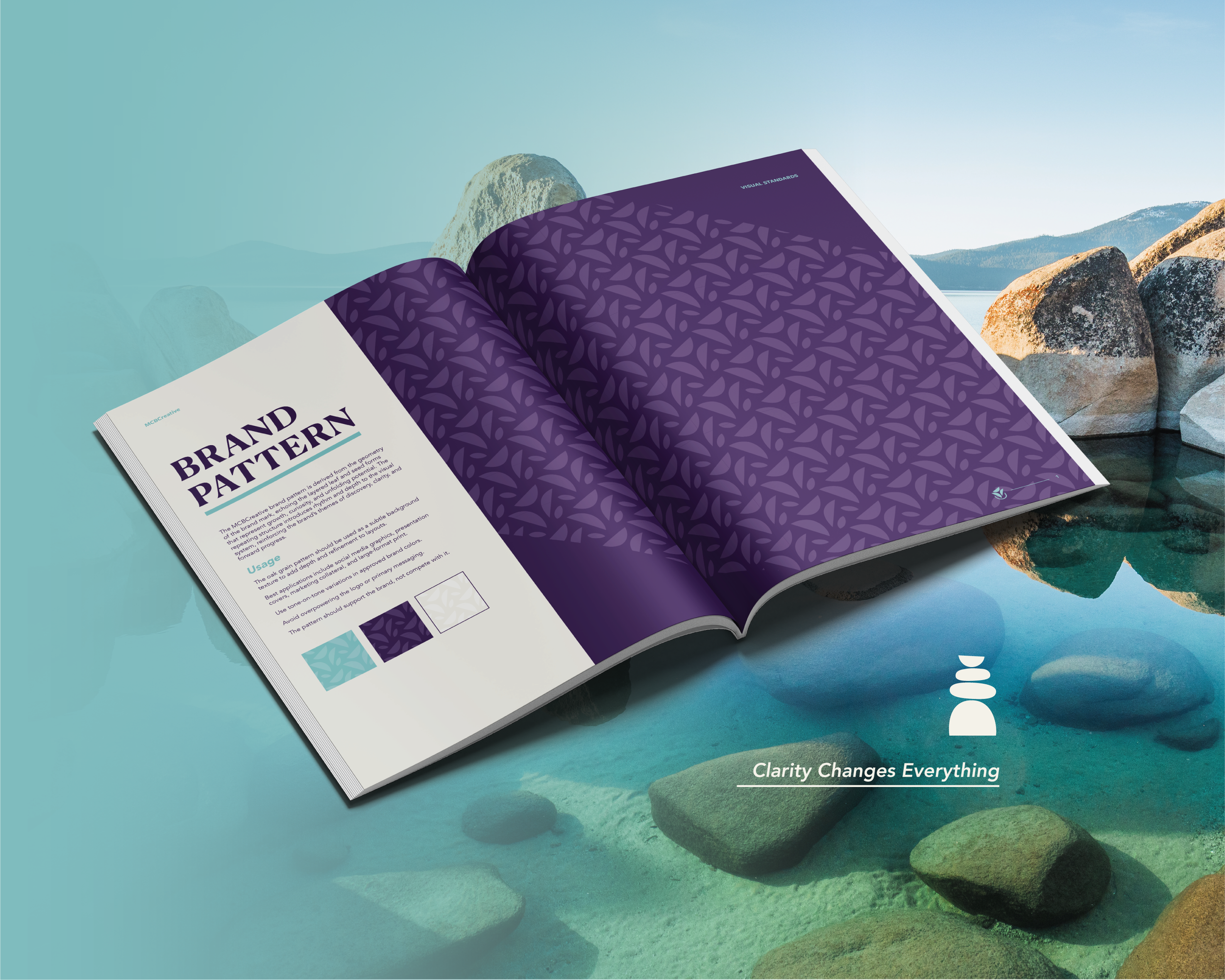 Open spread from the MCBCreative brand guidelines showcasing the custom brand pattern, demonstrating its application across full page layouts alongside the tagline, "Clarity Changes Everything."