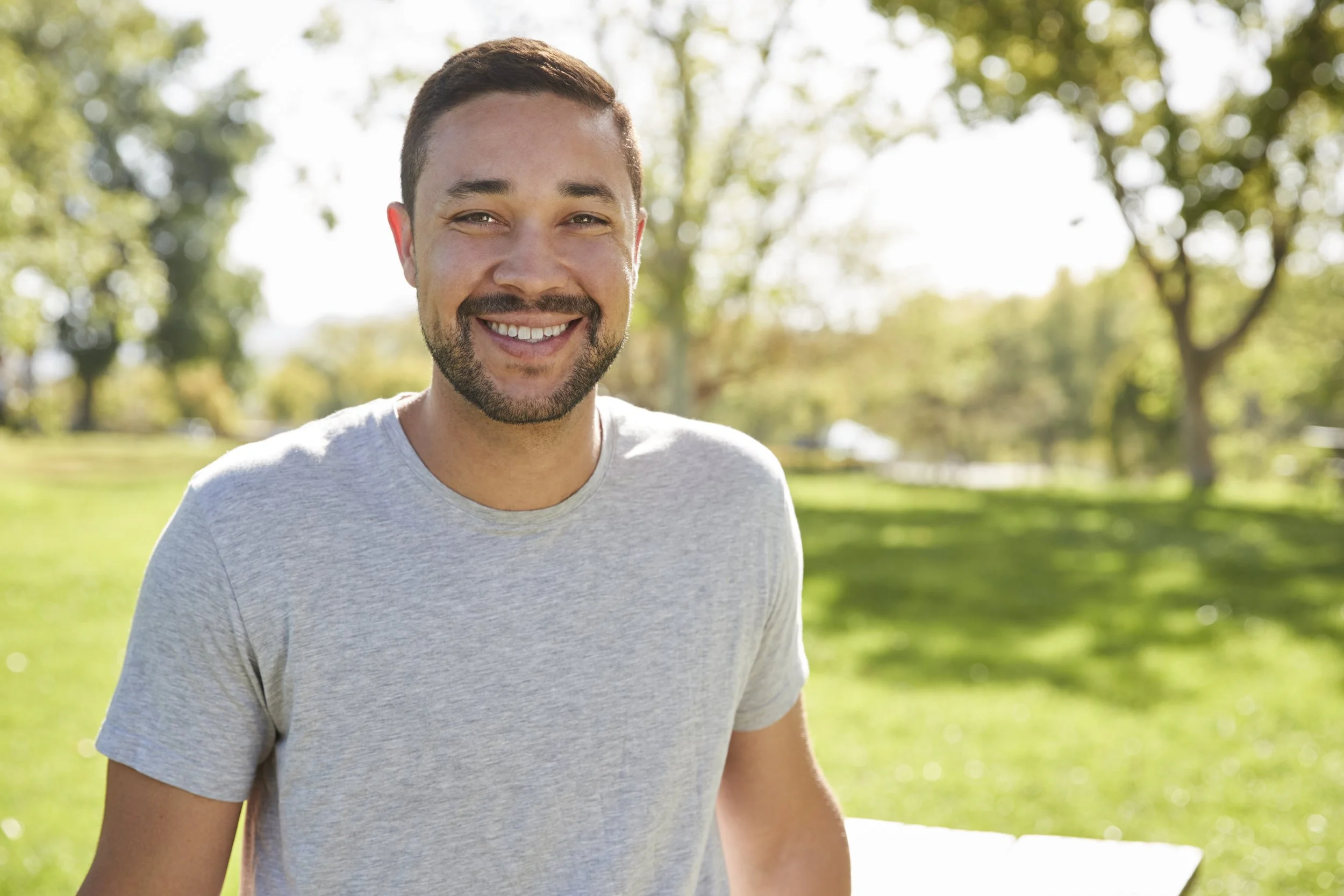 outdoor-head-and-shoulders-portrait-of-smiling-man-2022-02-02-03-48-06-utc.jpg