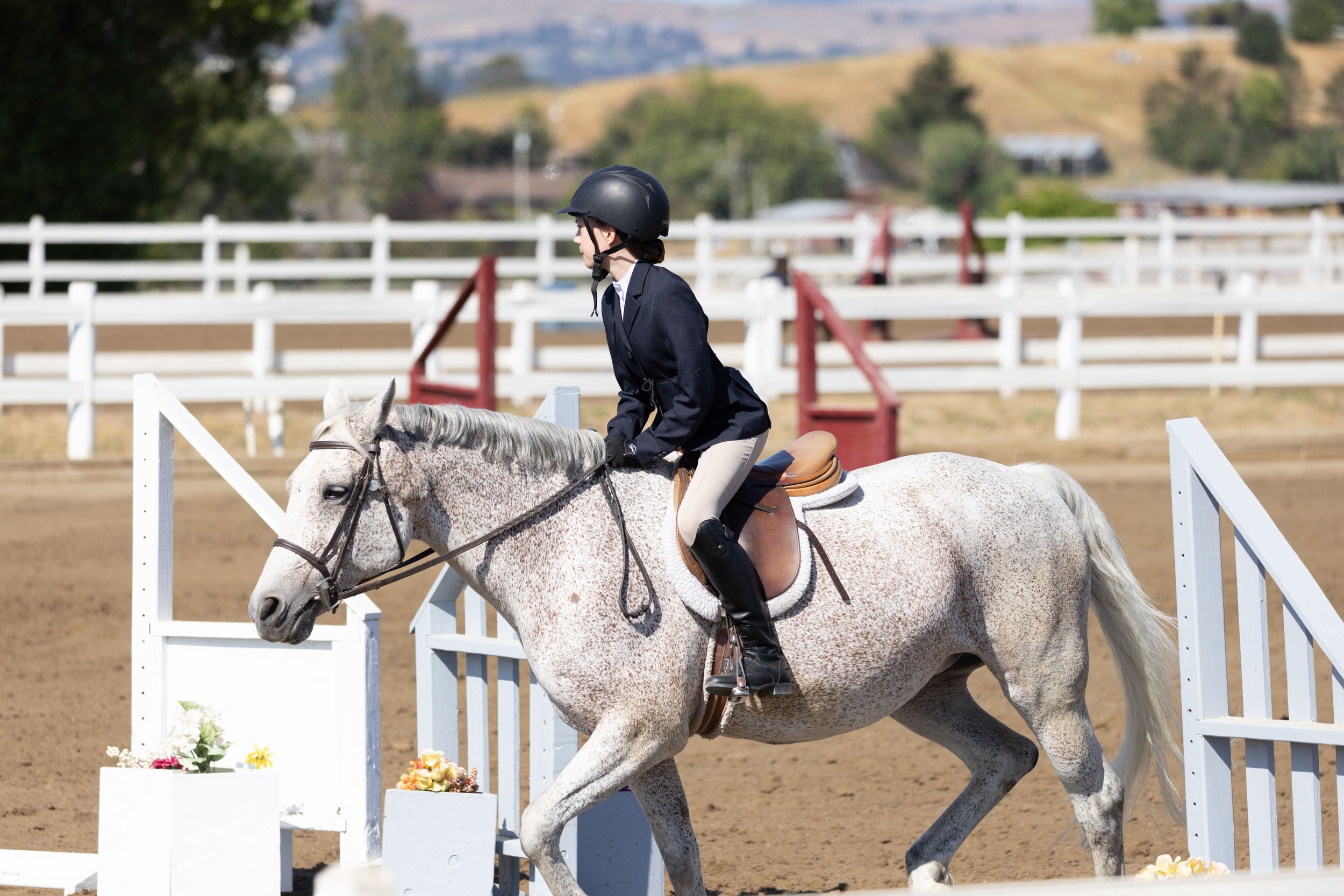 Girl horseback riding and developing awareness and leadership skills at Strides Riding Academy in Petaluma