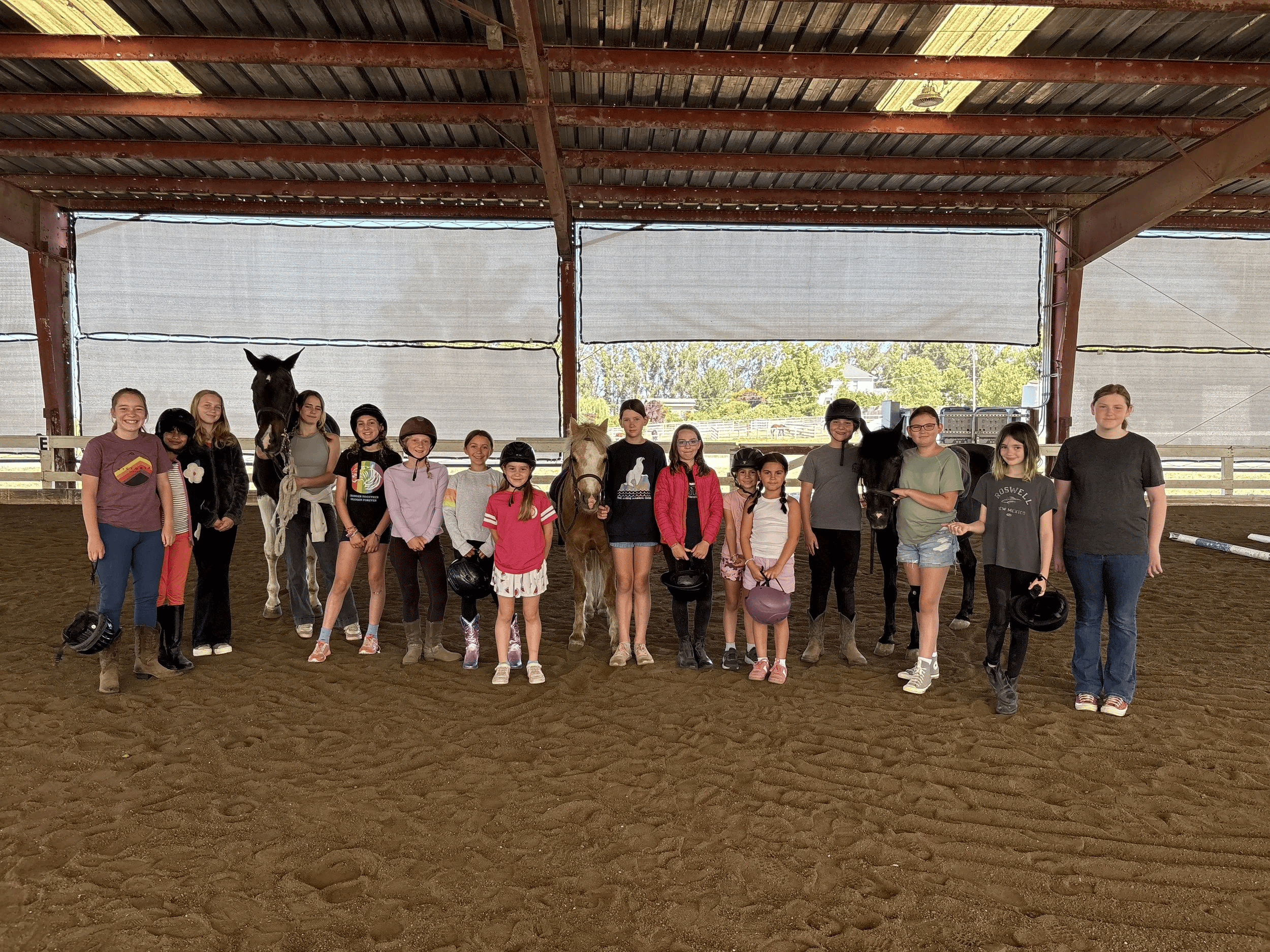 Campers and horses at Strides Riding Academy summer camp in Sonoma County.