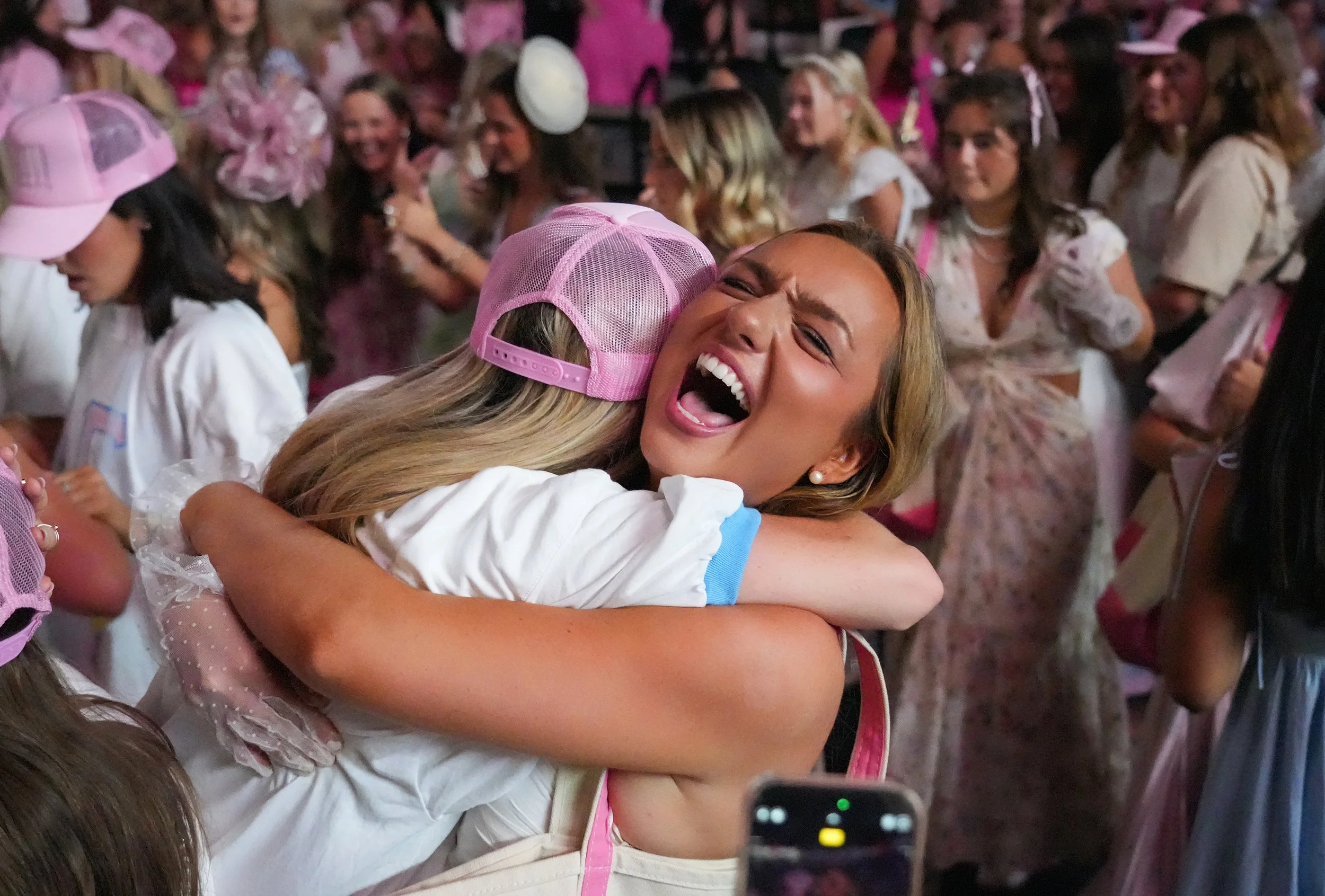  New Delta Gamma member Sophie Starks and active member Caroline Chaney embrace during Mississippi State Bid Day 2025 at the Humphrey Coliseum in Starkville, Miss., on Aug. 19, 2025. [Clarion Ledger] 