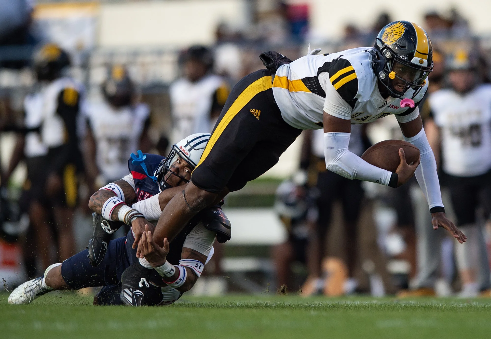  Jackson State Tigers' defensive back Shamar Hawkins (25) tackles Arkansas-Pine Bluff Golden Lions' quarterback Mekhi Hagens (9) during the game in Jackson, Miss., on Nov. 2, 2024. [Clarion Ledger] 