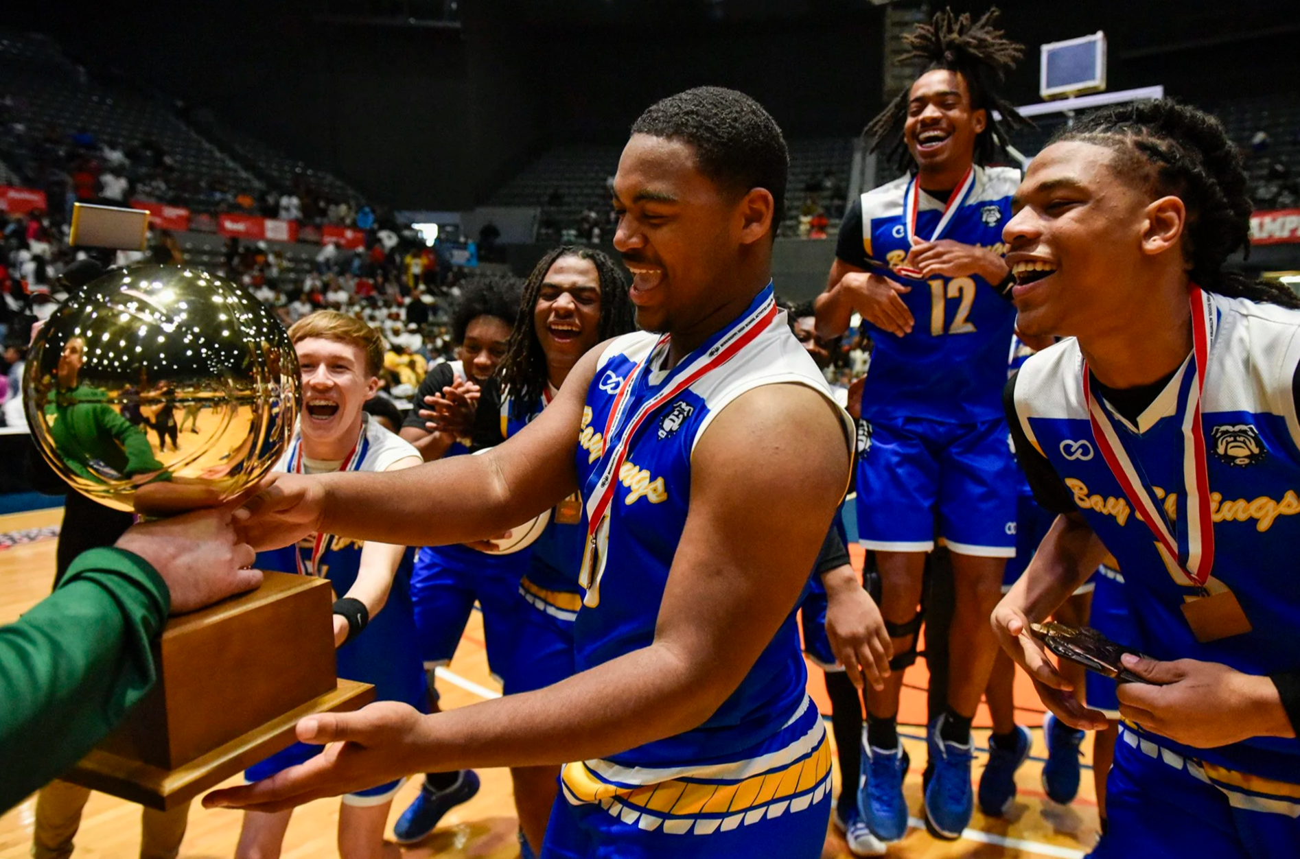  The Bay Springs Bulldogs accept the trophy for winning the MHSAA Class 2A state championship game against the Pelahatchie Chiefs at the Mississippi Coliseum in Jackson, Miss., on March 1, 2025. [Clarion Ledger] 