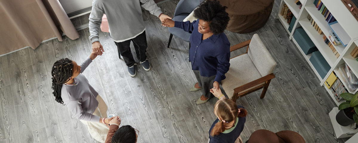 a group of young people holding hands together in a circle in bremerton, washington