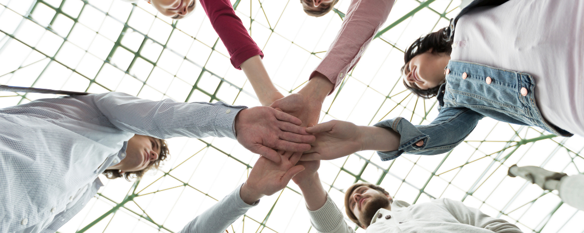 group of people joining hands together in bremerton, washington
