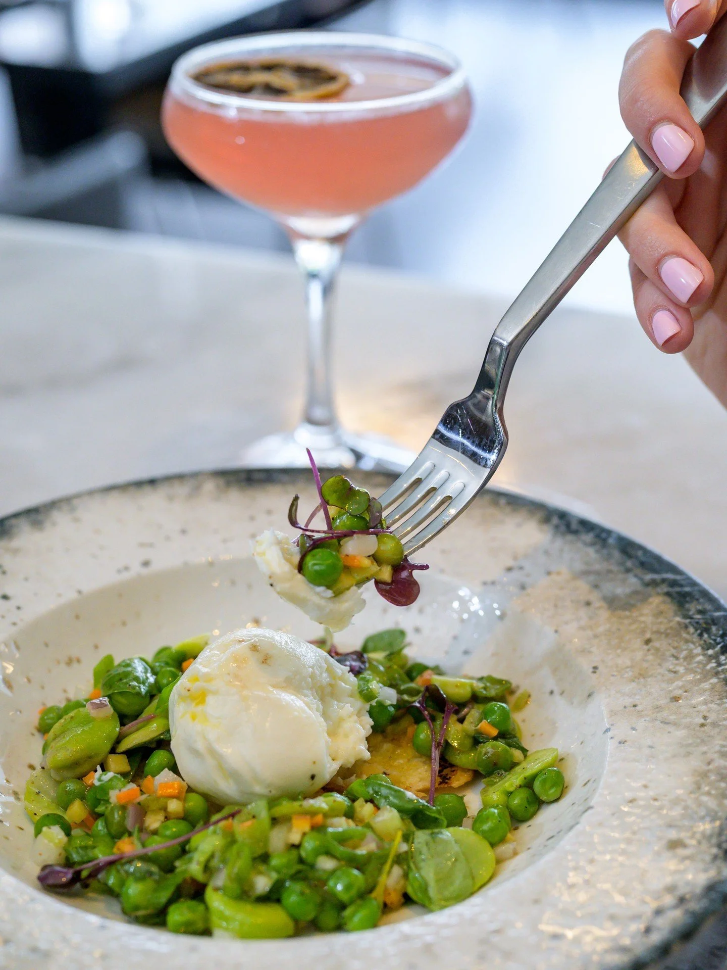 Indulge in pure perfection! 🧀 Our Burrata, adorned with fresh fava beans, green peas, mint, micro basil, and a zesty orange vinaigrette, is most fresh way to start a meal with your favorite people. Served with toasted bread, it's a dish that celebra