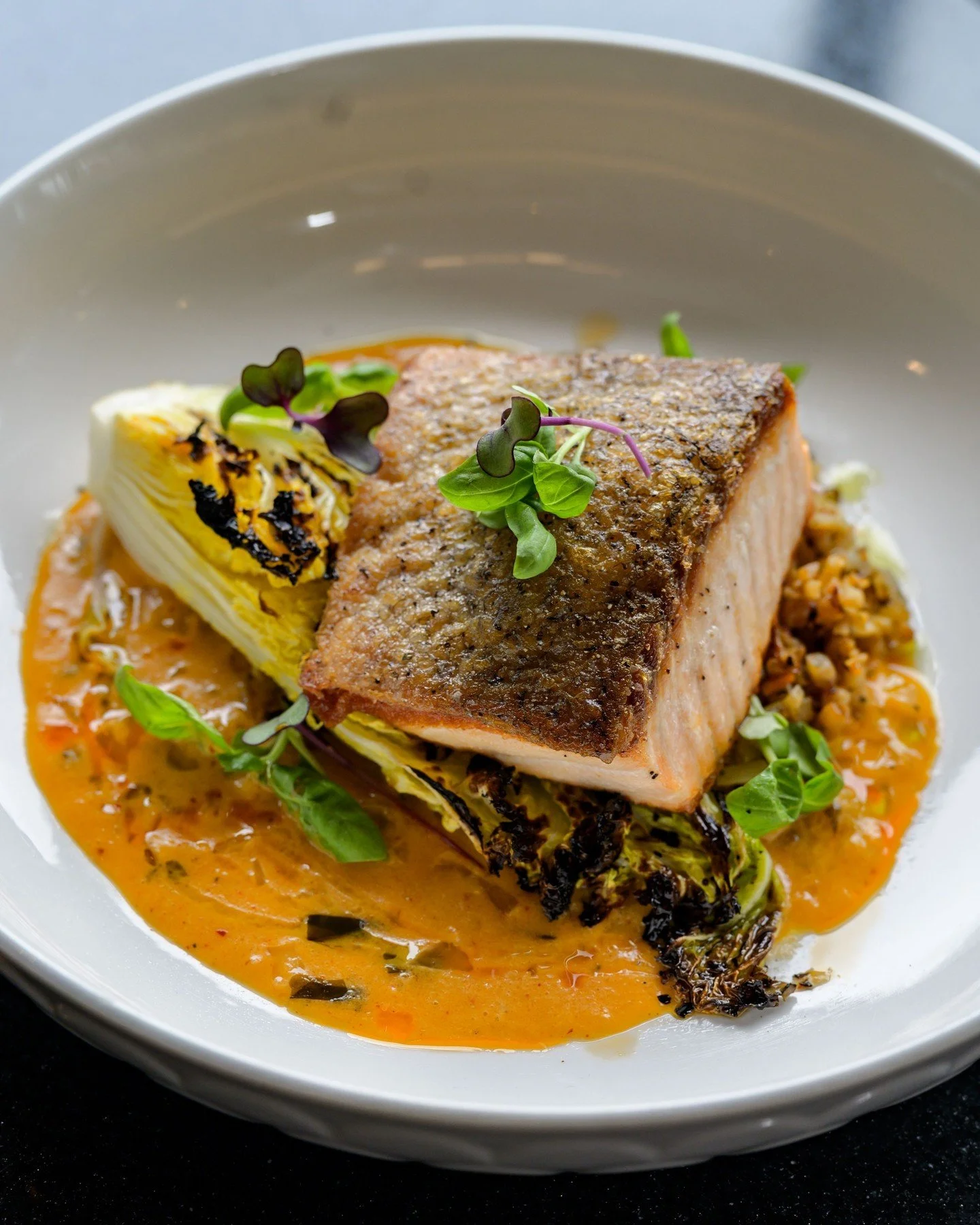Experience the delicate flavors of the Atlantic. Our Seared Atlantic Salmon is a must-try and a testament to modern New England dining. 

If you're headed to Gillette Stadium and looking for more than stadium snacks, make a reservation at Twenty8 and