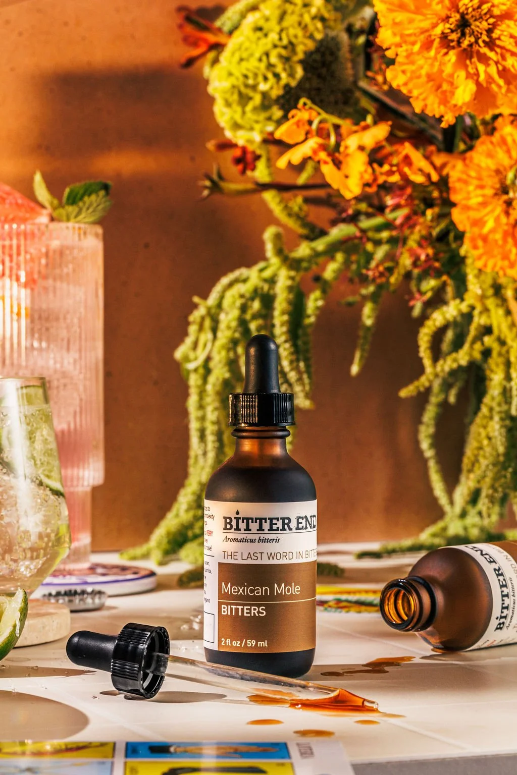 A product photo of bitters styled in a studio