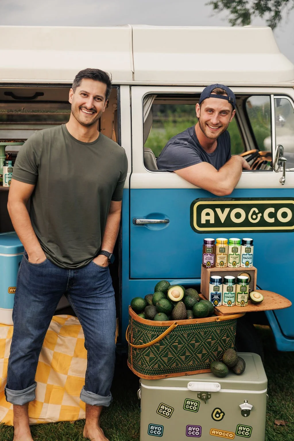 Two men in a vintage van with brand stickers for their brand photography