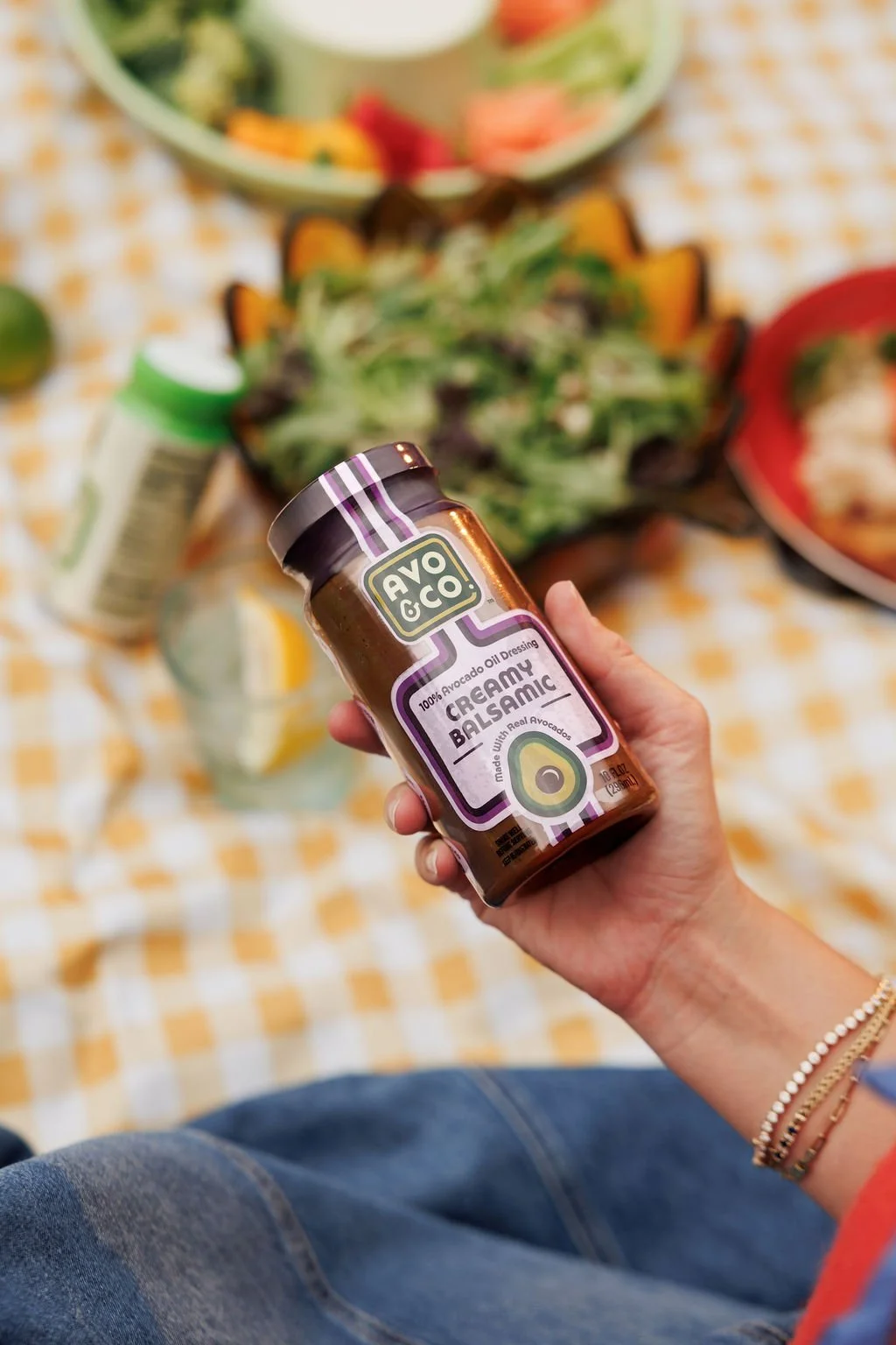product photography for a salad dressing brand in a staged picnic
