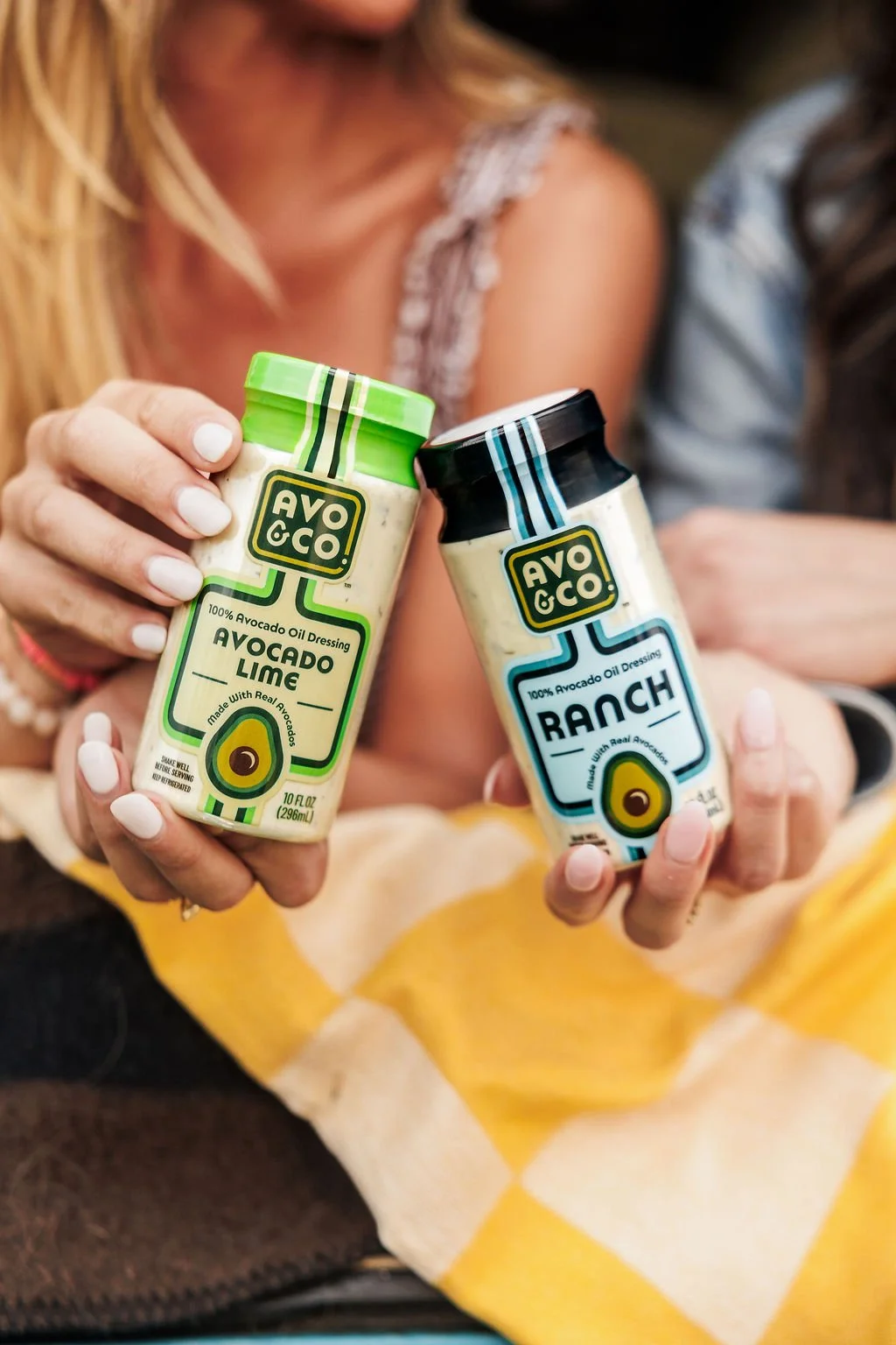 Brand photos showing women holding a product