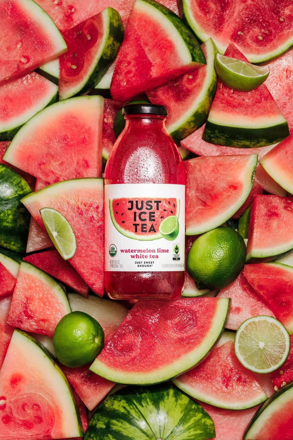 A product image of an iced tea in a bed of fruit