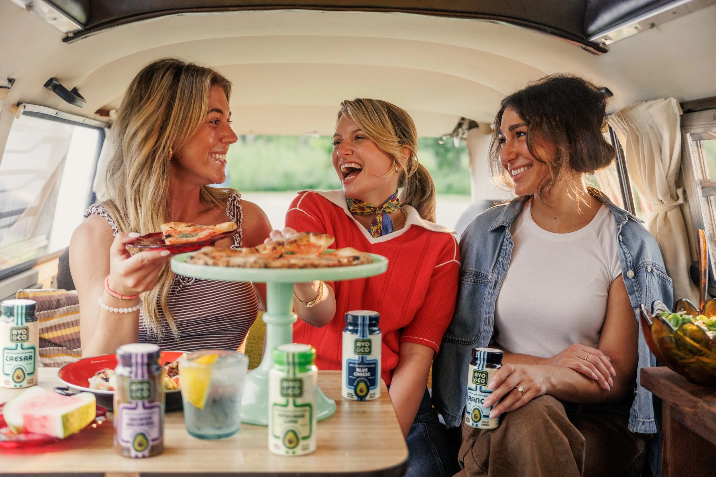 Women laughing while they're using ranch products in brand photography
