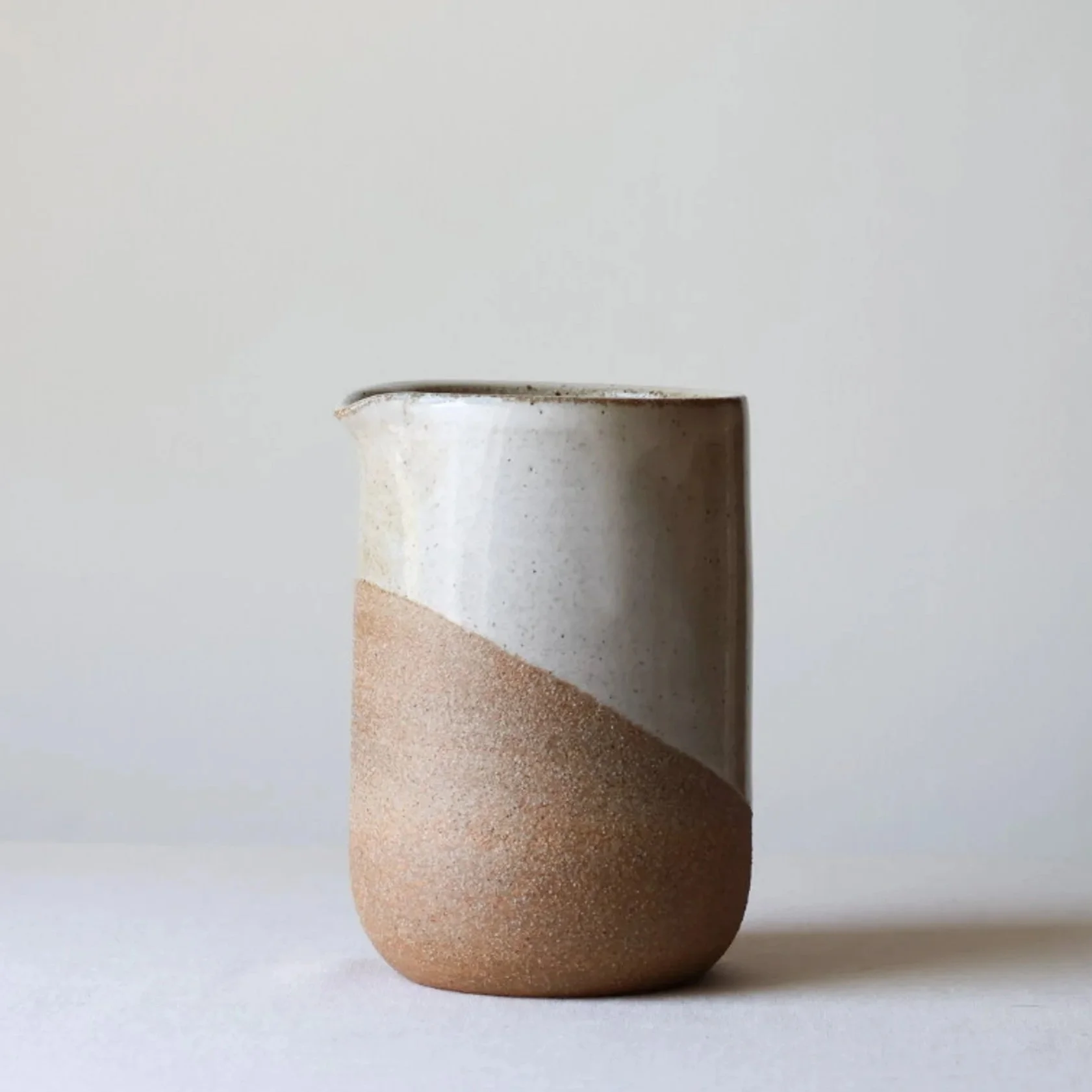 warm-white-handleless-pitcher-ii-1.jpg