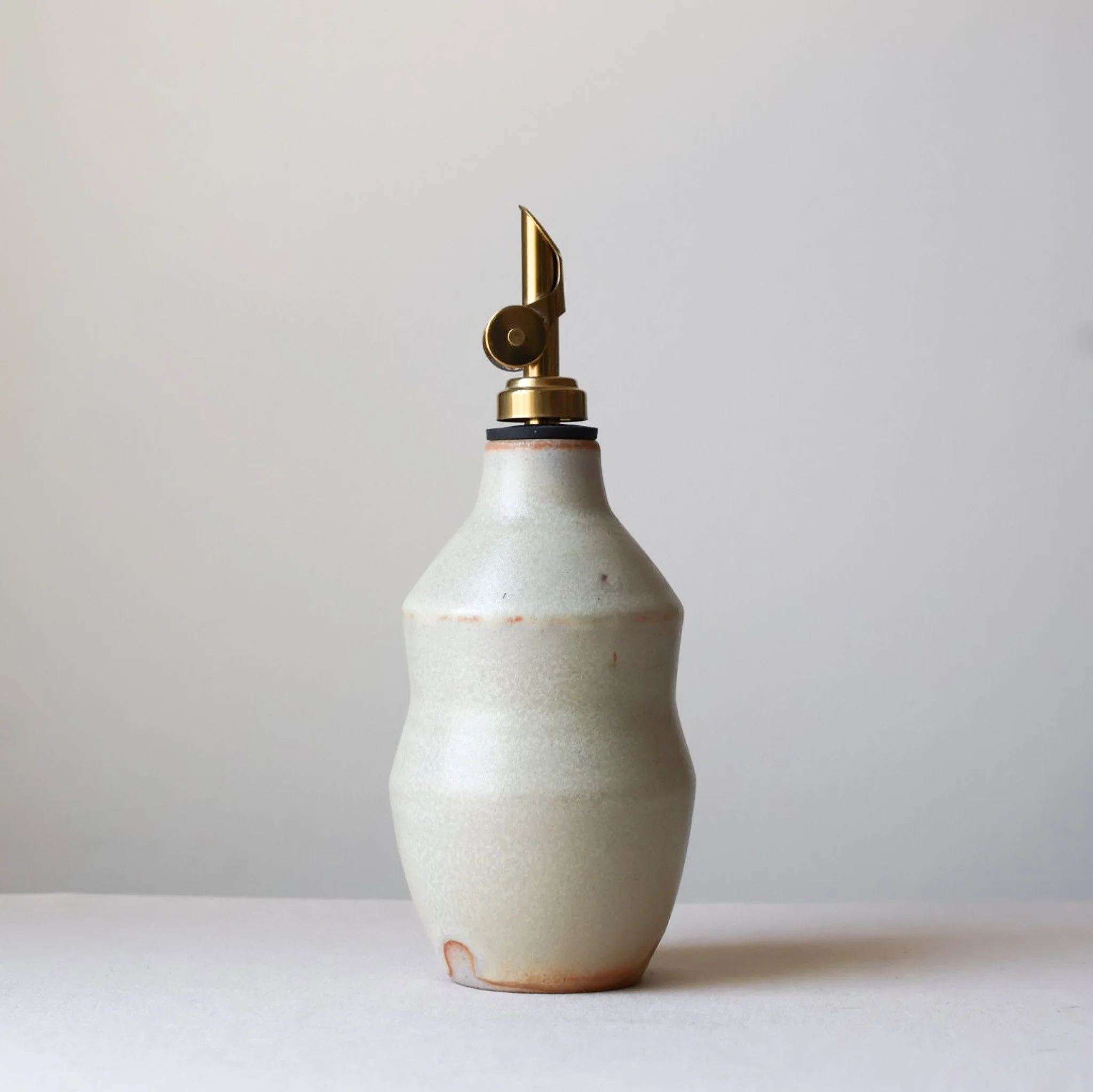 metallic-cream-waisted-oil-bottle-1.jpg