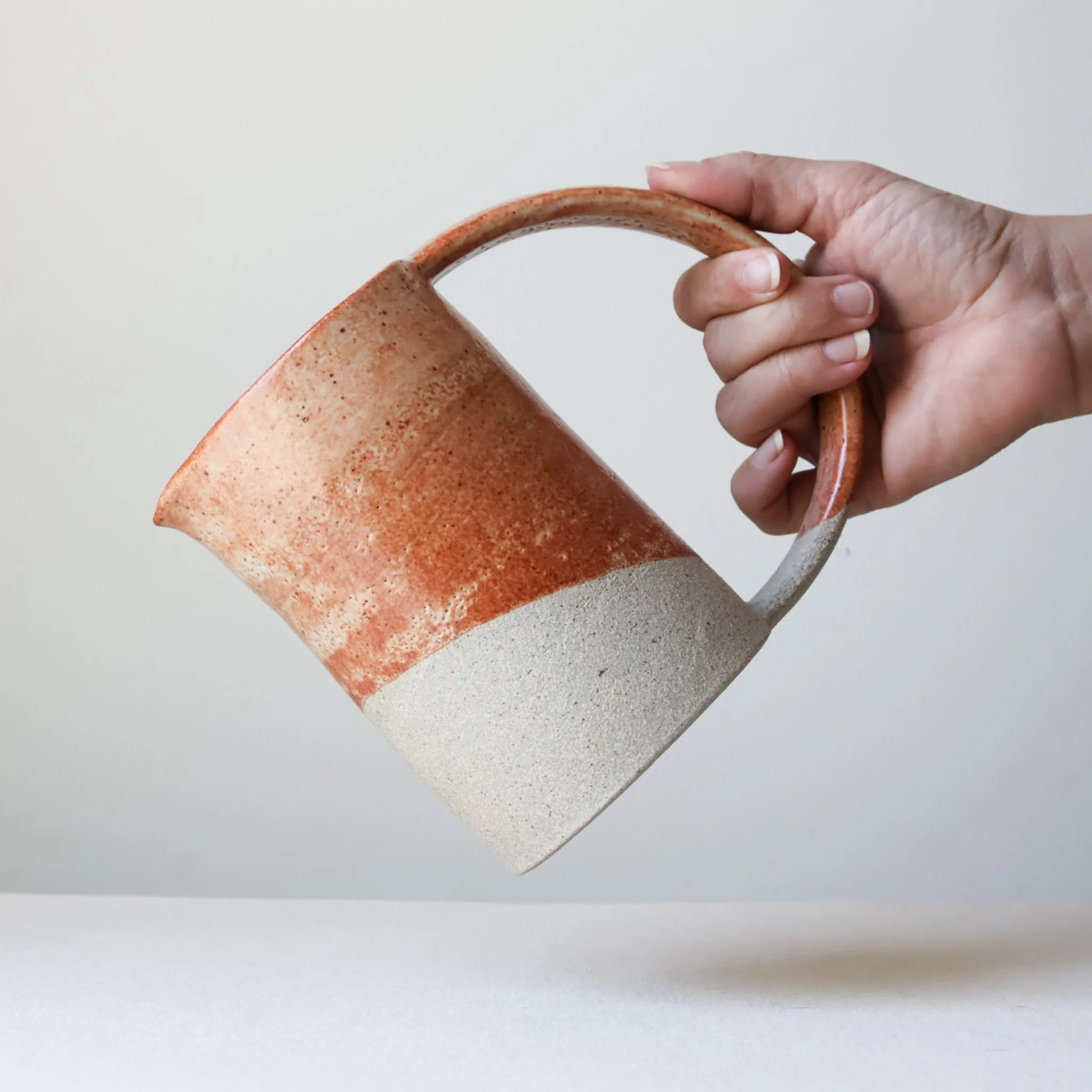 cream-rusty-coral-arc-handle-pitcher-3.jpg