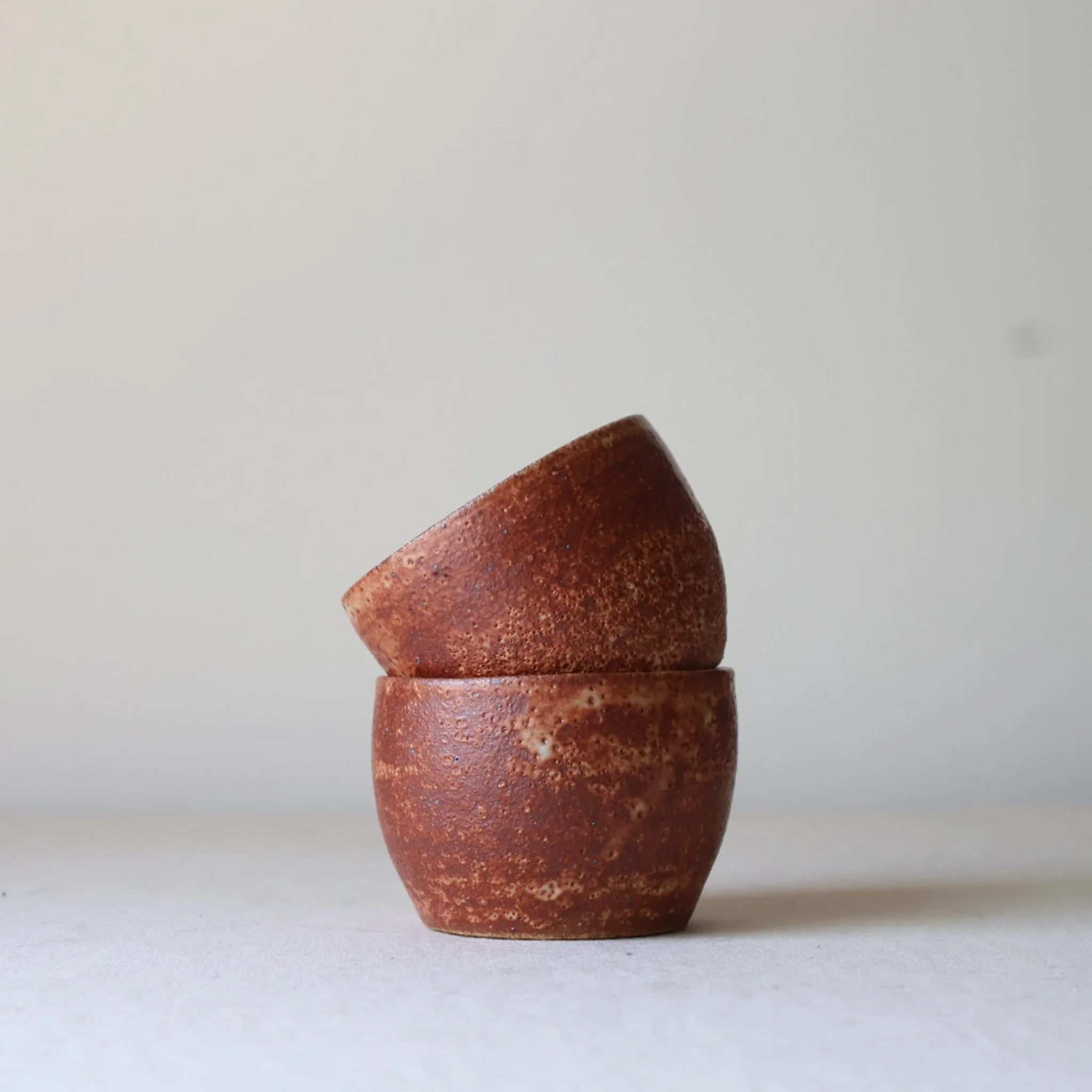 dark-rust-shino-sake-cups-set-of-two-1.jpg