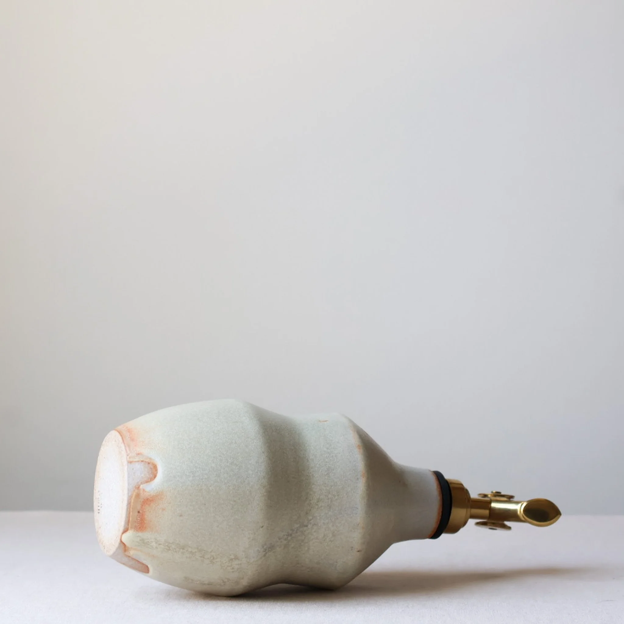 metallic-cream-waisted-oil-bottle-3.jpg