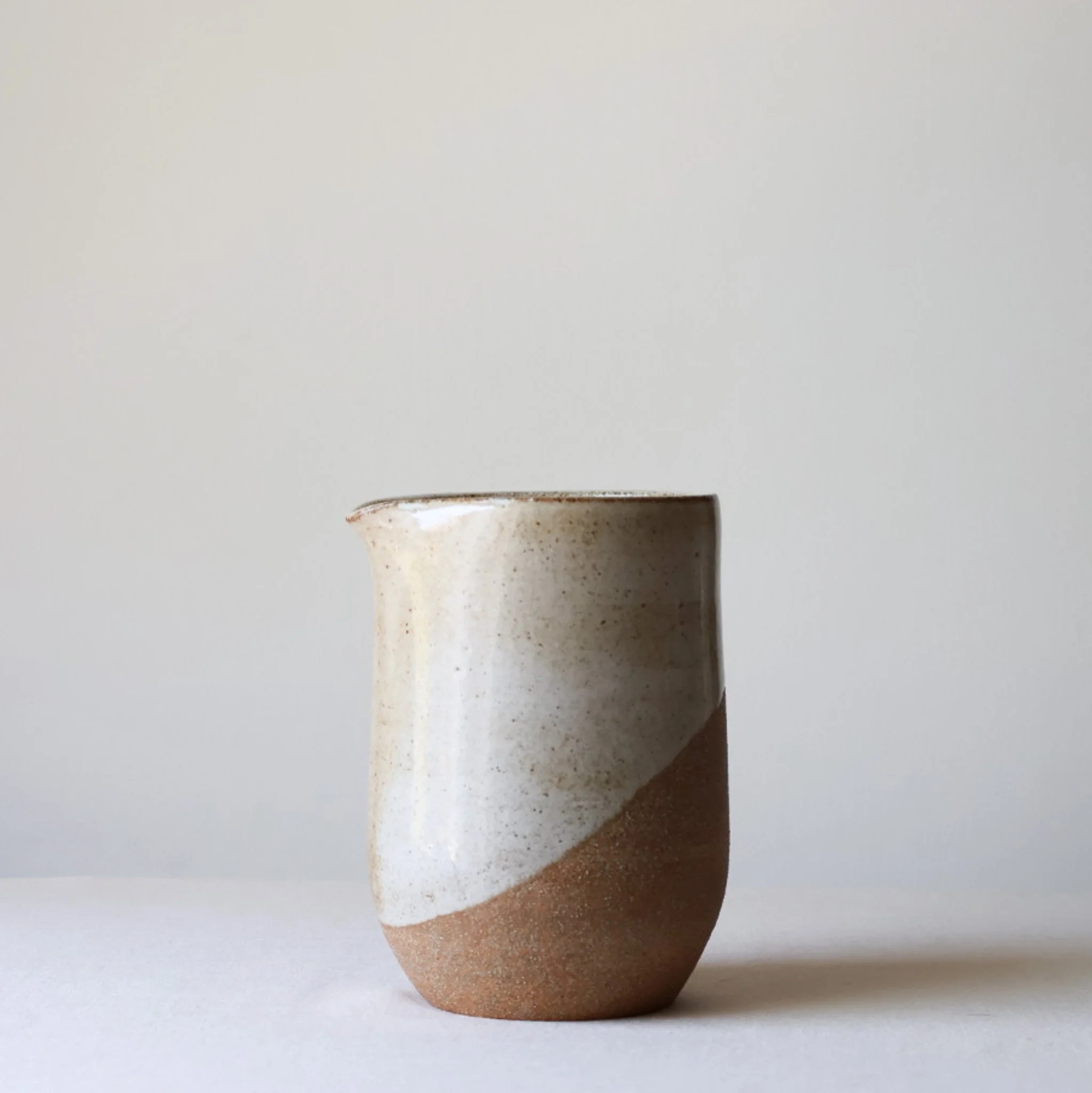 warm-white-handleless-pitcher-1.jpg