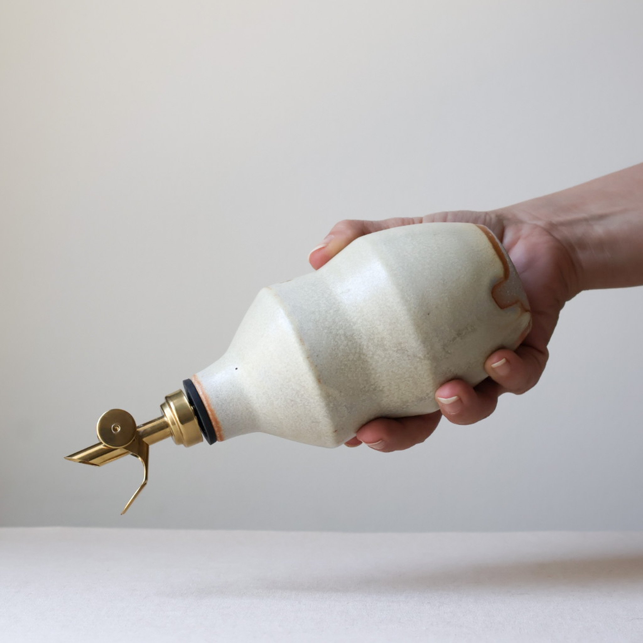 metallic-cream-waisted-oil-bottle-2.jpg