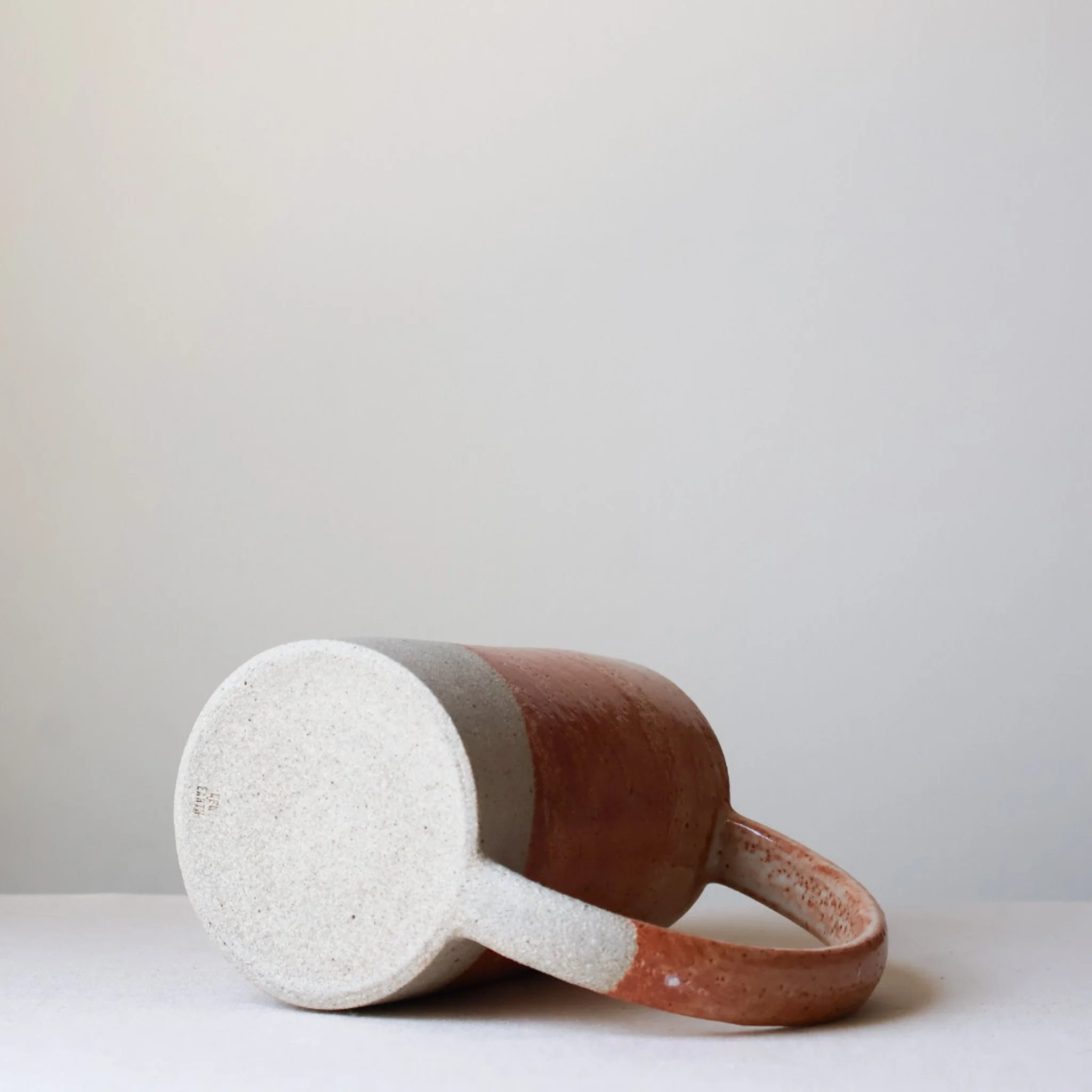 cream-rusty-coral-arc-handle-pitcher-4.jpg