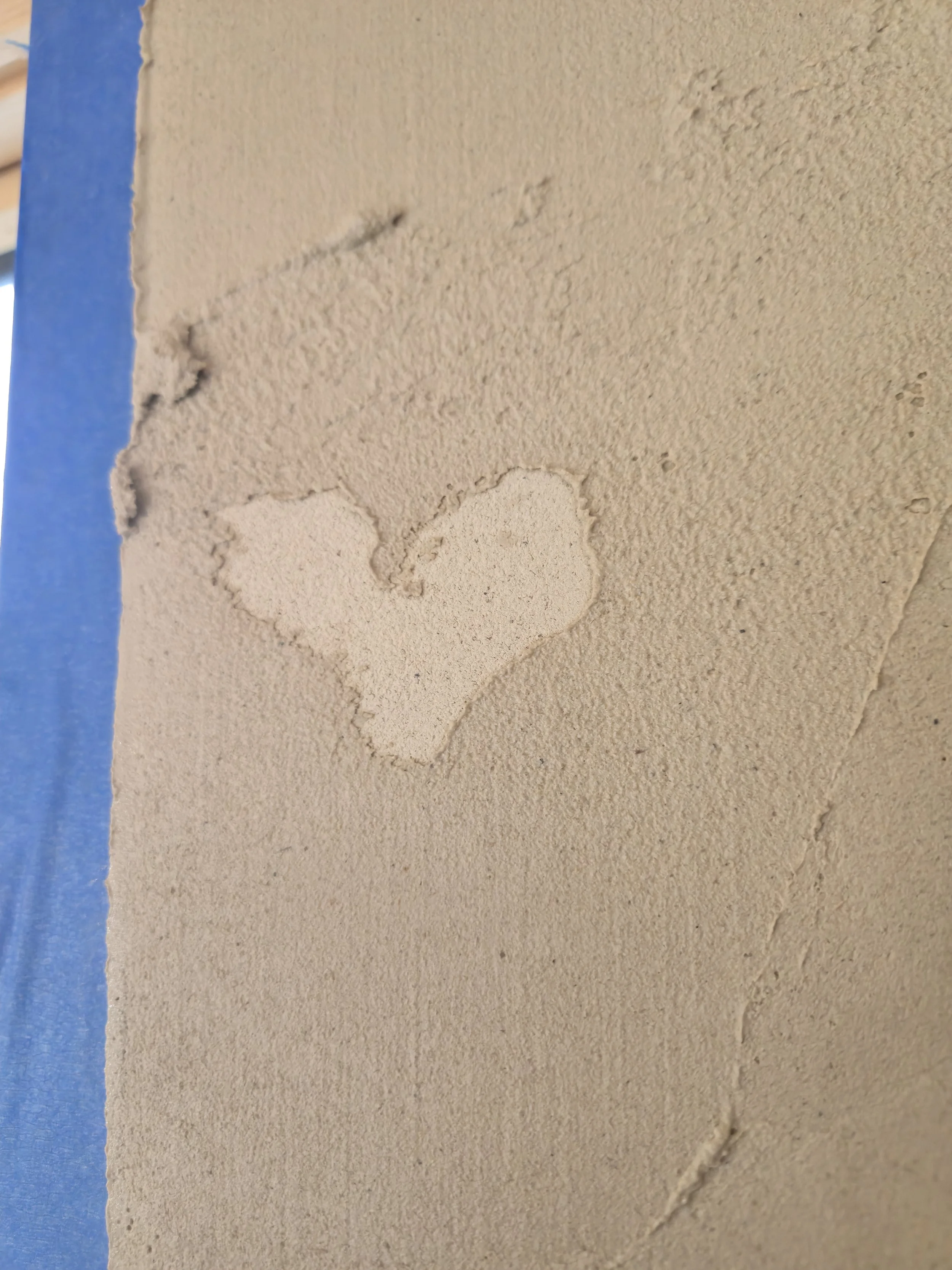 a fresh patch of clay shaped like a heart