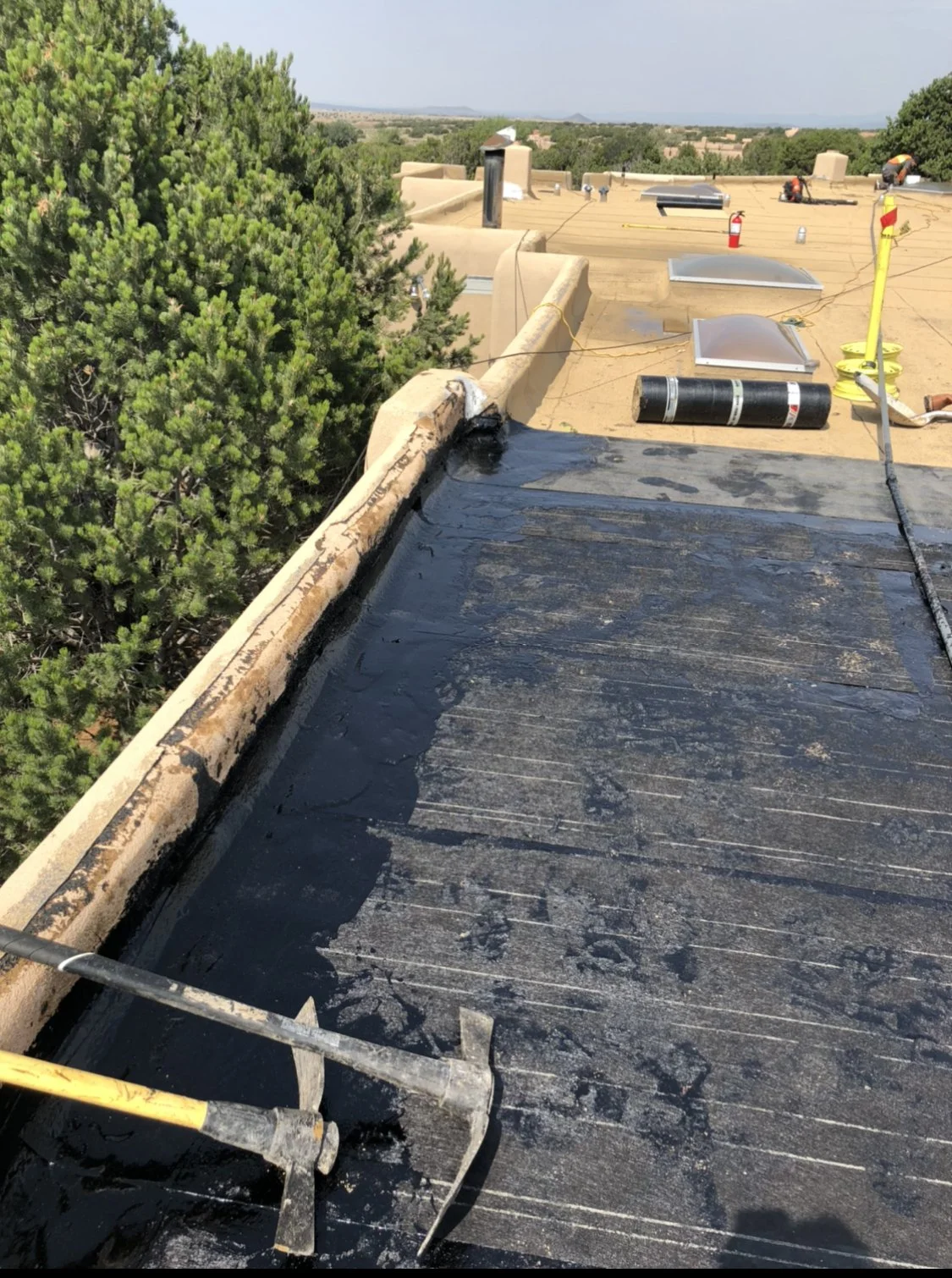Re-roof in progress on a flat roof