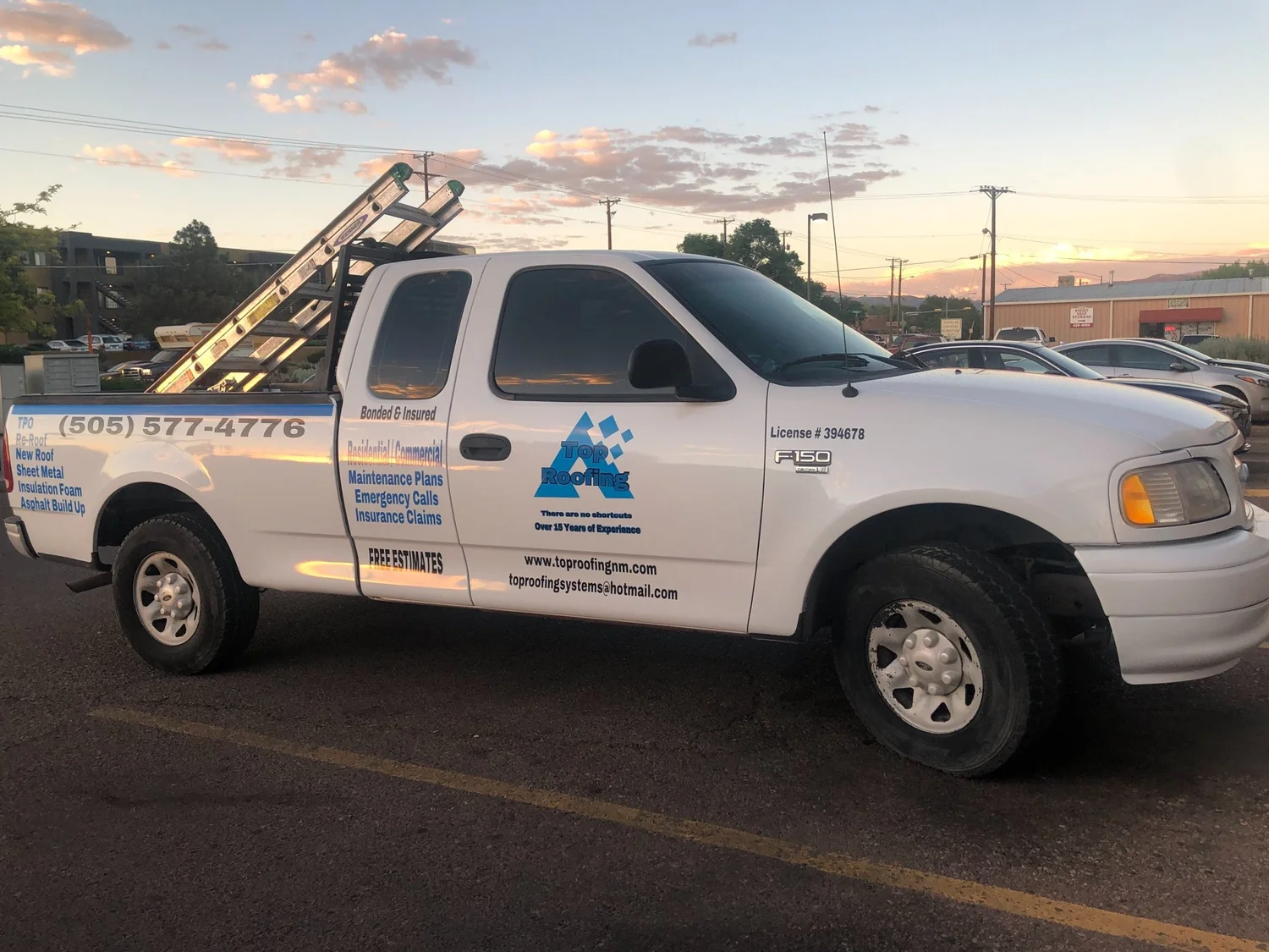 Top Roofing pickup truck with company logo