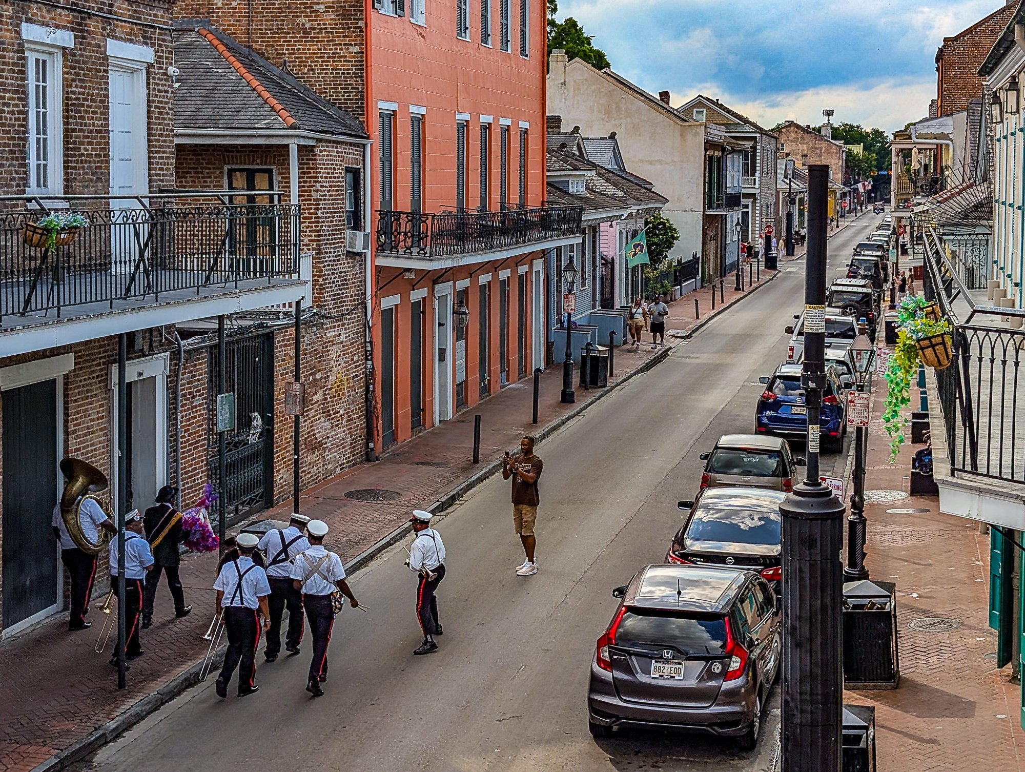 It’s midday on a Saturday, and Bourbon Street has thinned out. But the band doesn’t care. They’re singing, dancing, and grooving down the block like they’re leading a second line. No audience? No problem. They’re their own celebration—moving toward R