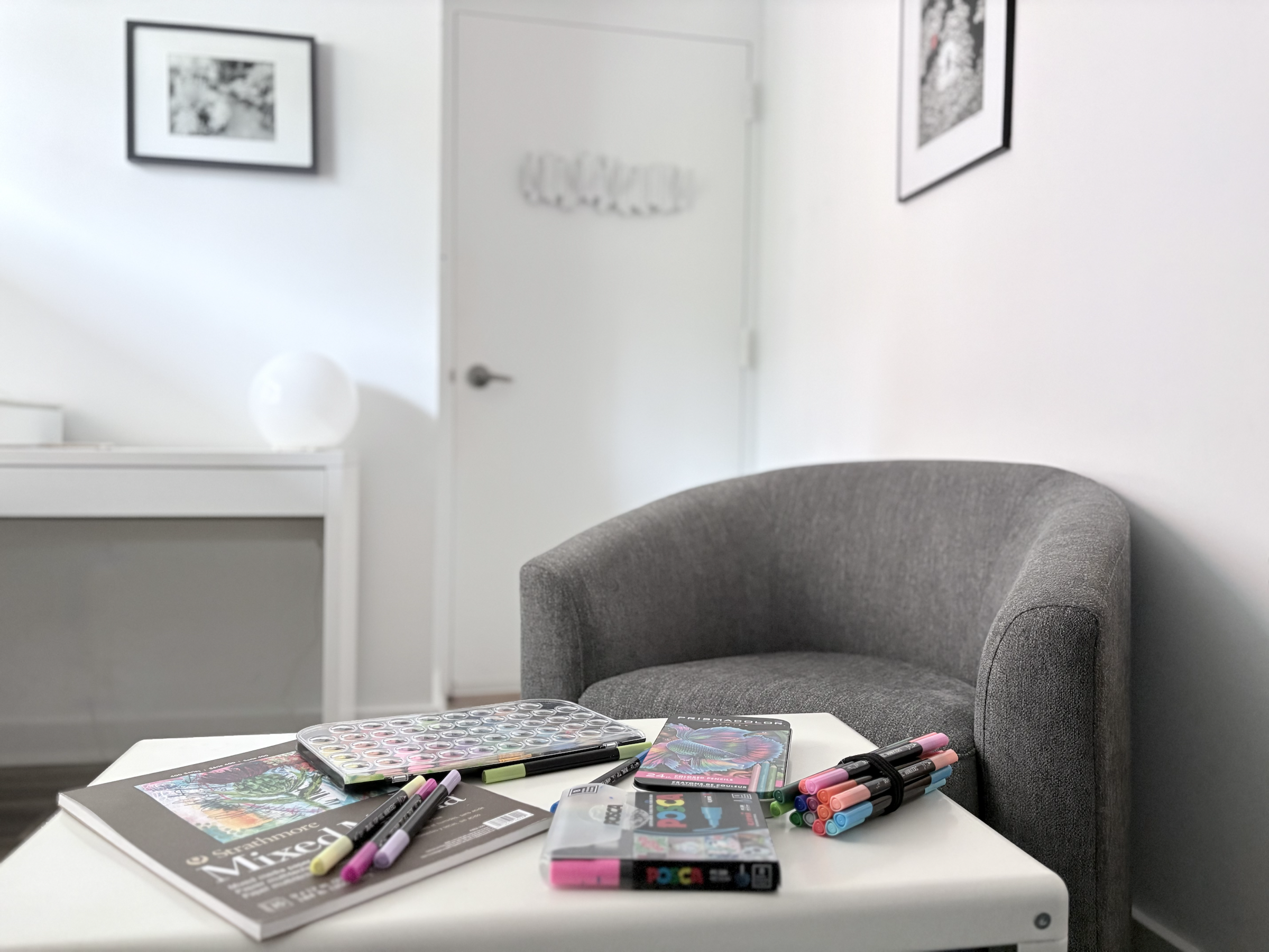 Art materials arranged on a white table in Beth Tutt’s Northwest Washington, DC therapy office